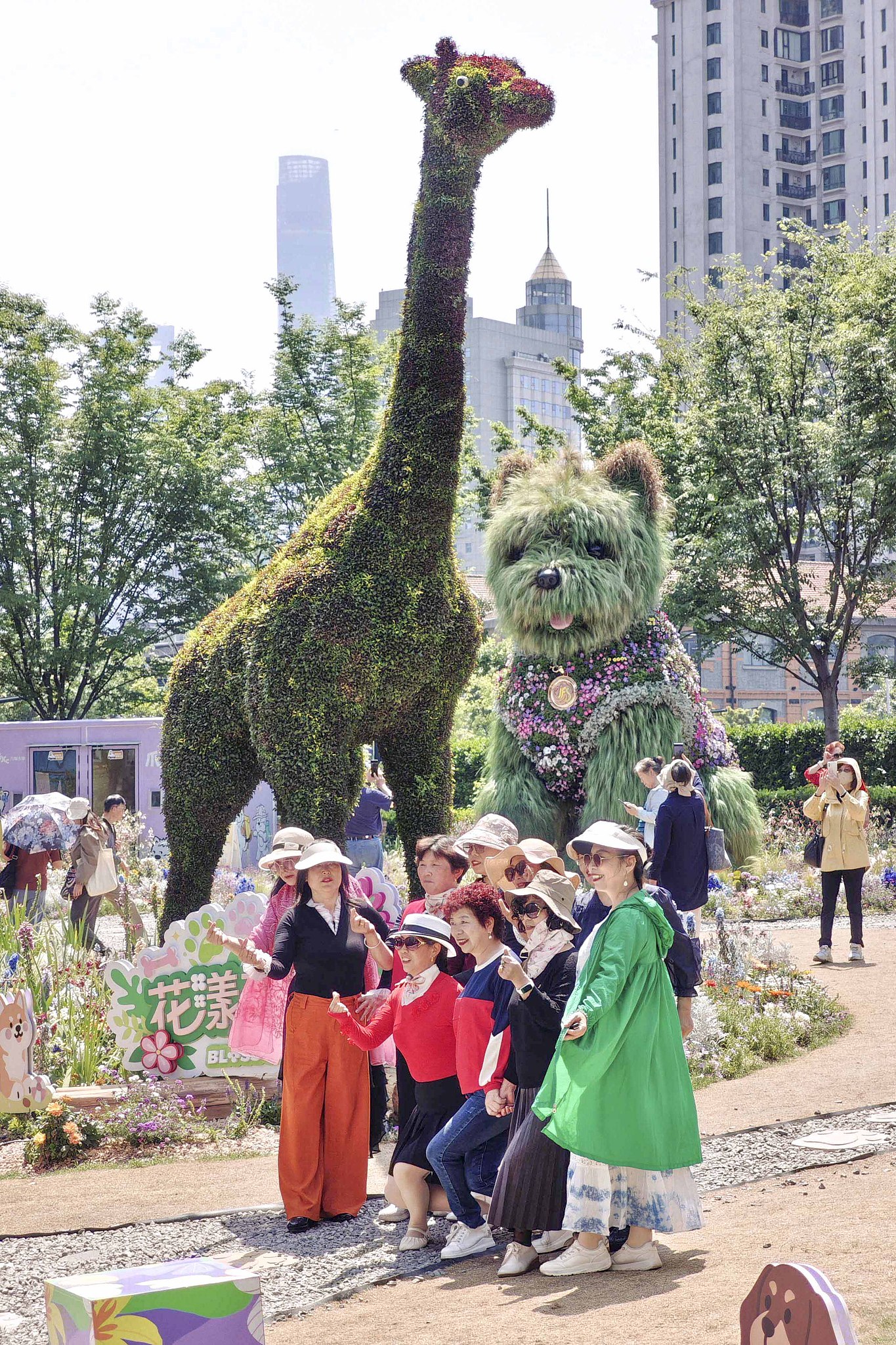 Visitors pose for photos in front of the 