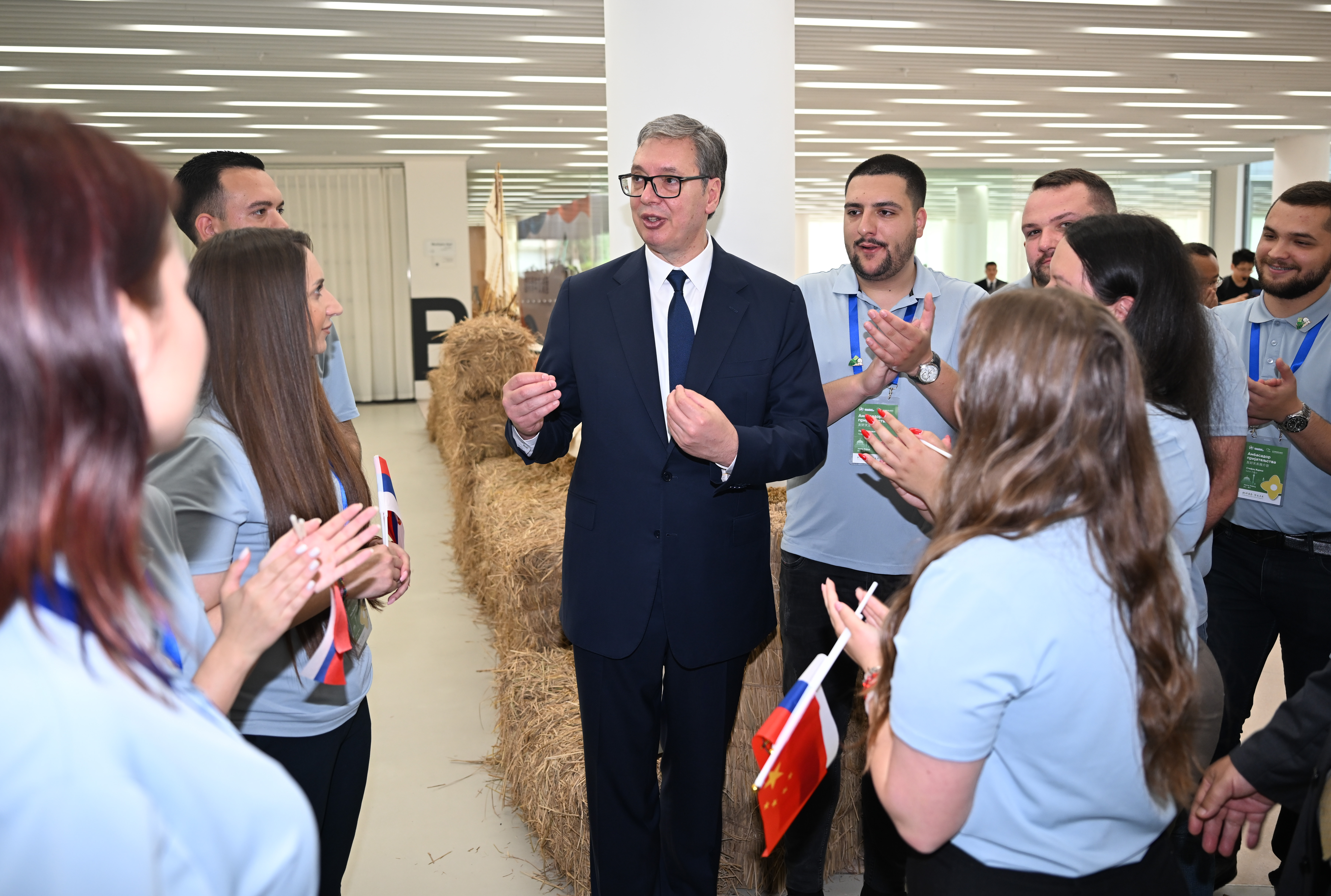 Serbian President Aleksandar Vucic talks to young Serbians on an exchange program in China during his visit to the Minth Group in Jiaxing, east China's Zhejiang Province, on May 27, 2026. /IC