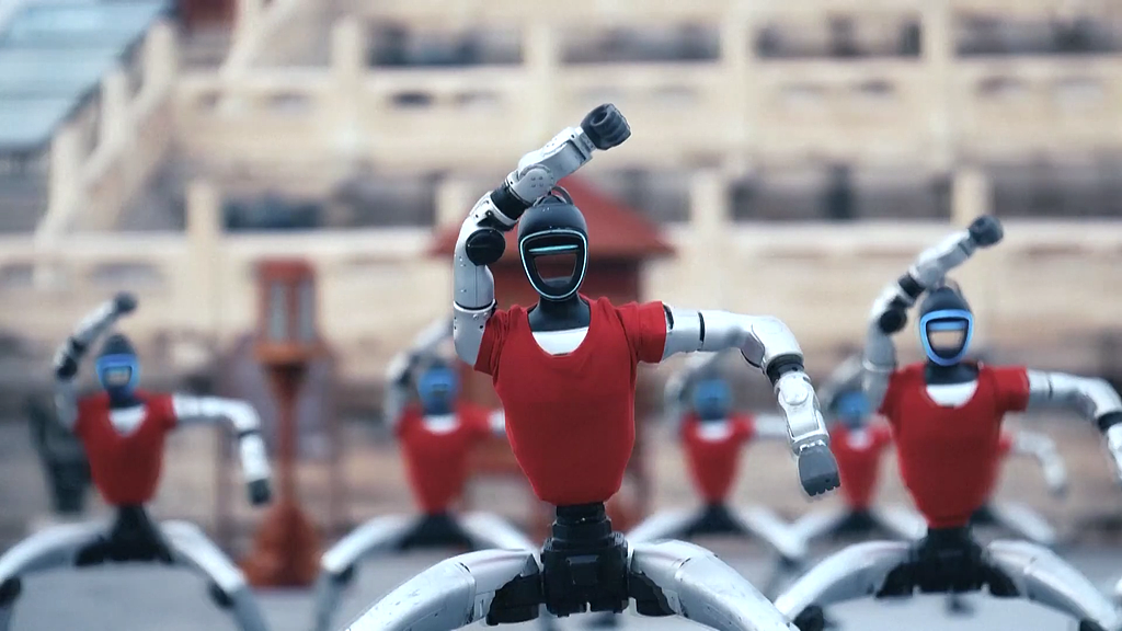 Unitree's robots are seen in a video released by the company, performing Kungfu in front of the Temple of Heaven in Beijing. /VCG
