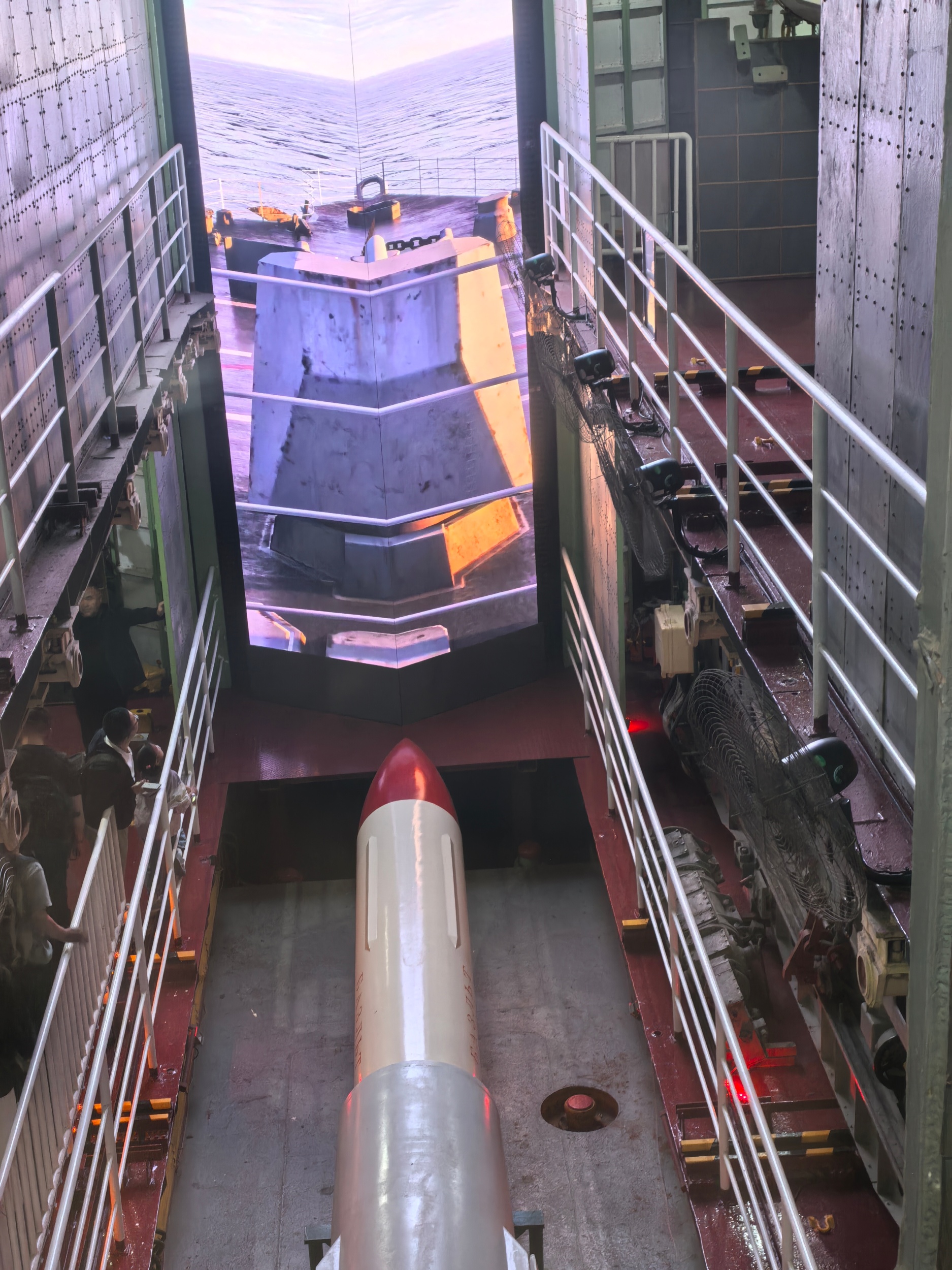 Touritsts visit a torpedo in a decommissioned aircraft carrier at Tianjin TEDA Aircraft Carrier Theme Park, on May 3, 2026. /CGTN
