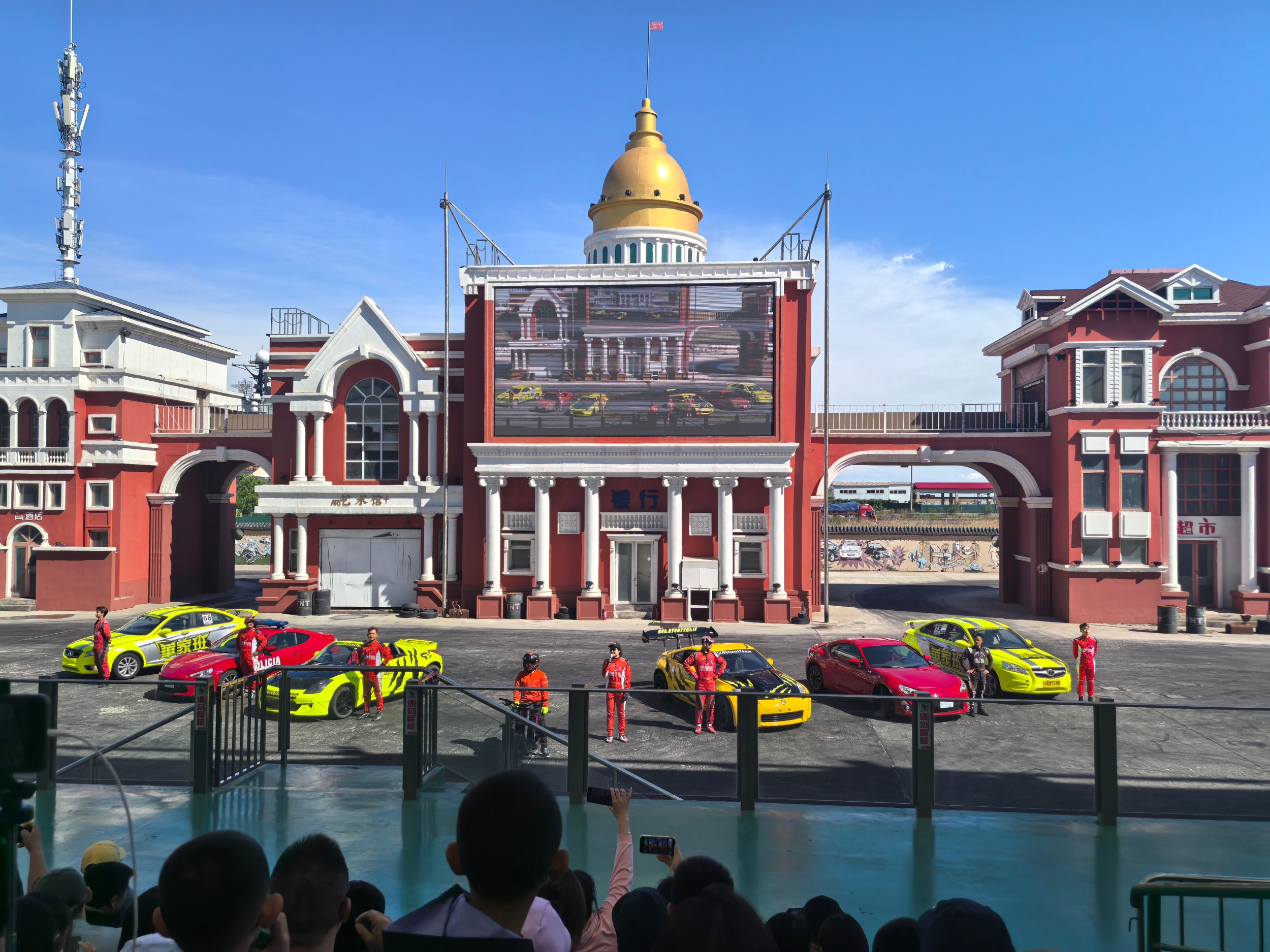 Tourists watch Stunt Driving Show at Tianjin TEDA Aircraft Carrier Theme Park, on May 3, 2026. /CGTN