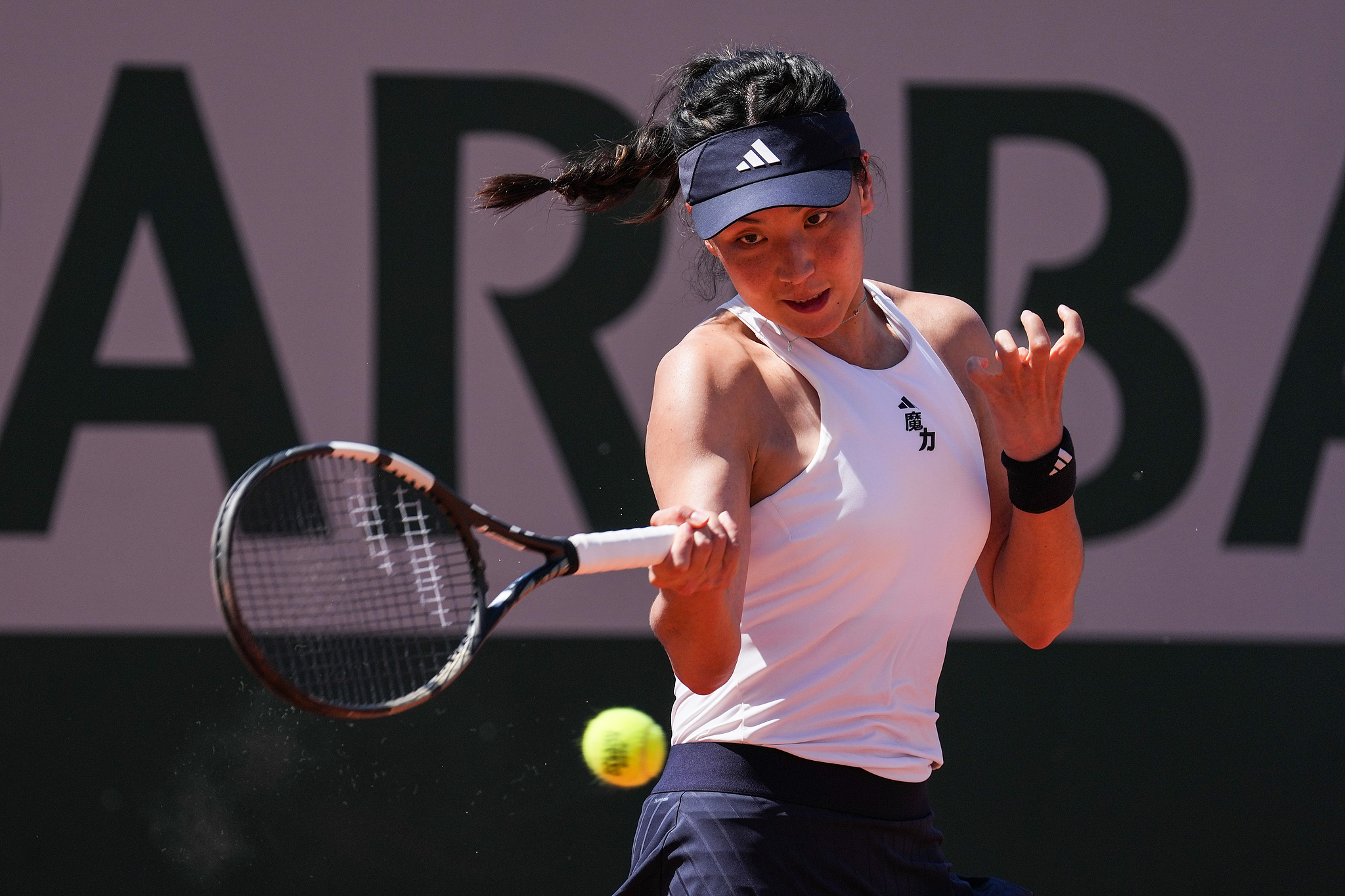 China's Wang Xinyu hits a shot against Germany's Tamara Korpatsch in a women's singles second-round match at the French Open at Roland Garros in Paris, France, May 27, 2026. /VCG