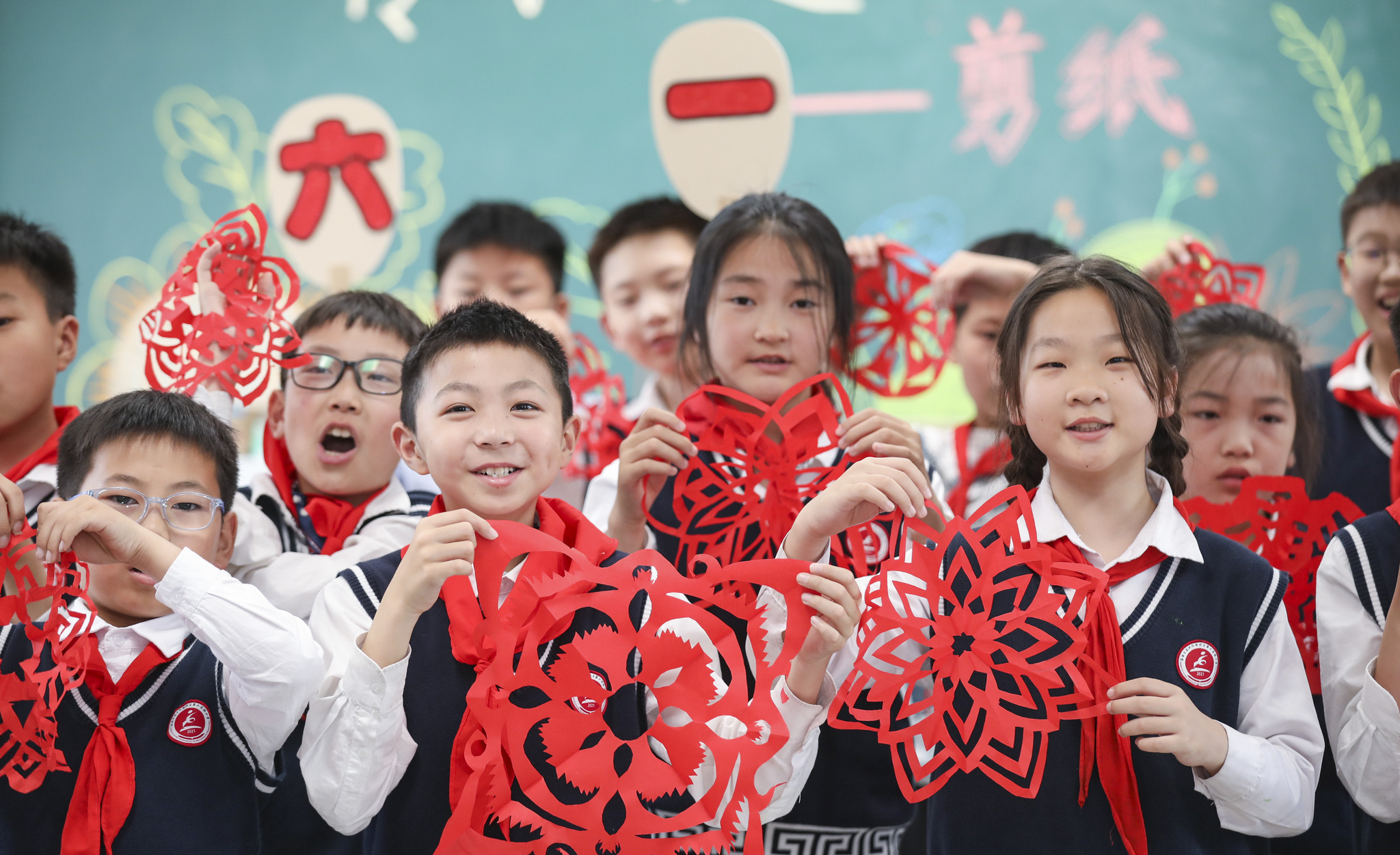 Children from a primary school in Huaian City, east China's Jiangsu Province, display their paper-cutting works as part of their Children's Day celebrations. /VCG
