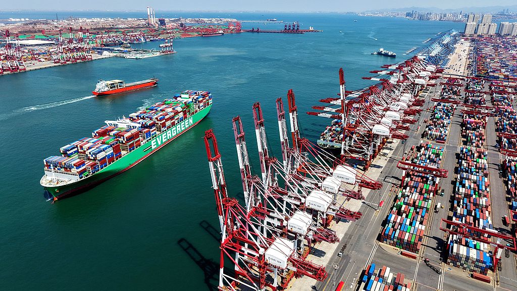 A cargo ship loaded with containers meant for foreign trade docks at the Qingdao Port in eastern Shandong Province, China, April 7, 2026. /CFP