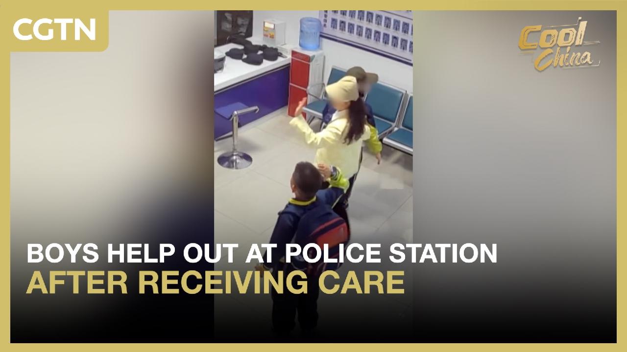 Boys help out at police station after receiving care - CGTN