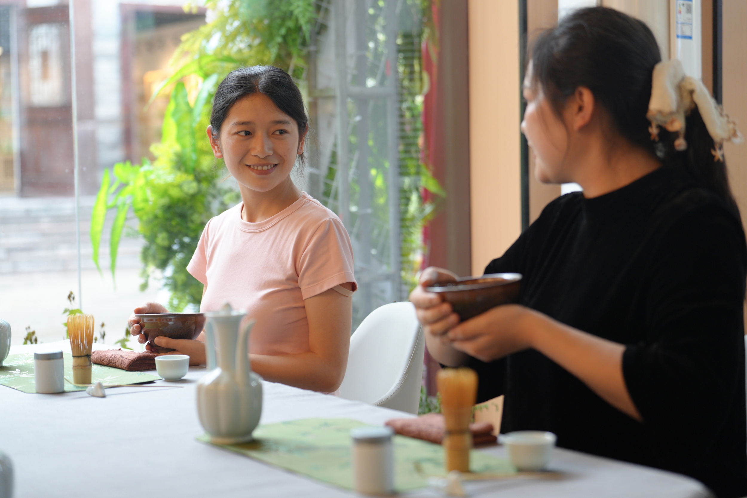 Visitors experience the traditional matcha tea ceremony at a matcha-themed town in Tongren City, southwest China's Guizhou Province on May 29, 2026. /Tongren Media Convergence Center