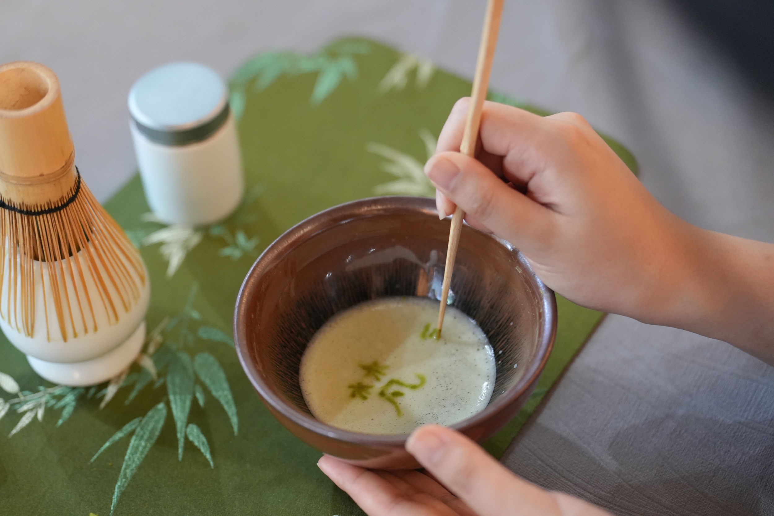 Visitors experience the traditional matcha tea ceremony at a matcha-themed town in Tongren City, southwest China's Guizhou Province on May 29, 2026. /Tongren Media Convergence Center