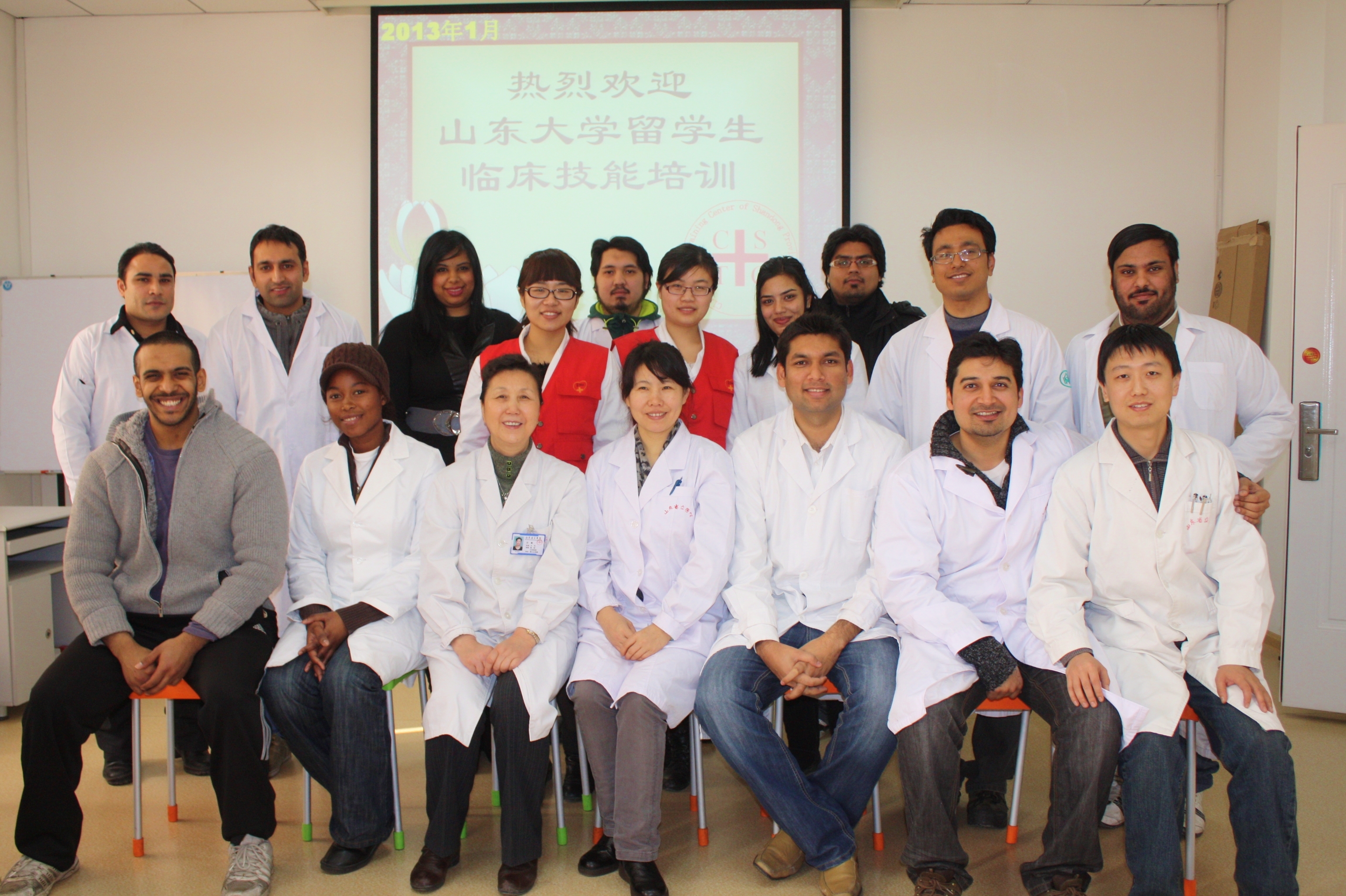 Muhammad Shahbaz (front row, third from right) takes a group photo with doctors and fellows at the inaugural Physical Examination and Surgery Operational Techniques Program at Shandong Provincial Hospital, China, 2013.