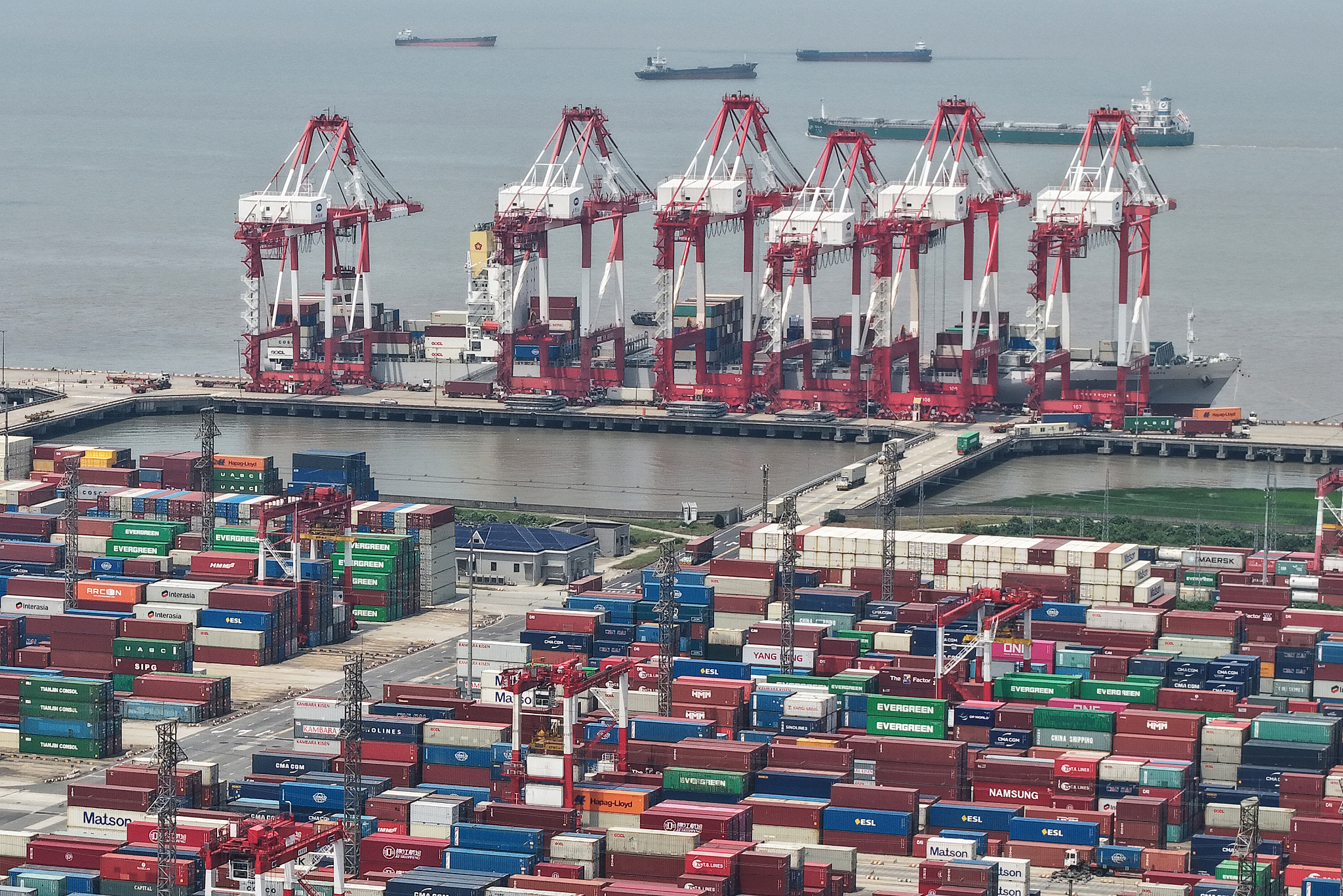 A pile of containers at a dock of Shanghai Port in Shanghai, China, May 18, 2025. /VCG