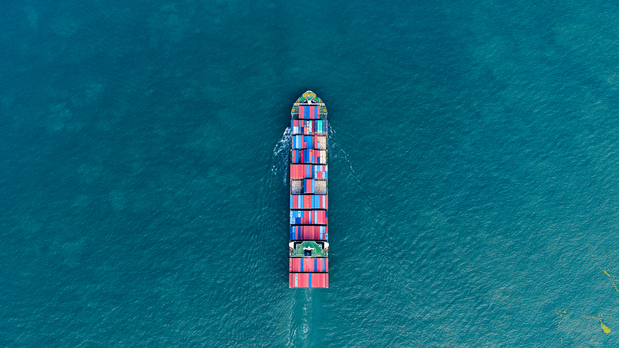 A cargo ship loaded with containers departing from Qingdao Port in Qingdao, Shandong, China, June 29, 2025. /VCG