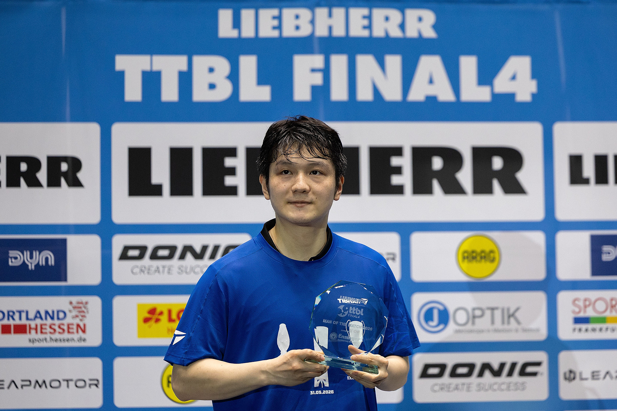 Fan Zhendong of Saarbrücken-Tischtennis poses with the Player of the Match award after defeating Borussia Düsseldorf 3-1 in the Table Tennis Bundesliga Final4 championship match at Süwag Energie ARENA in Frankfurt, Germany, May 31, 2026. /VCG