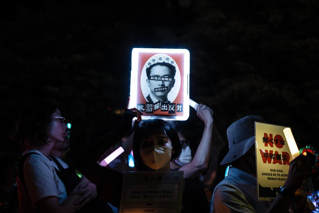 People holding signs attend a protest rally in front of the National Diet Building in Tokyo, Japan, May 29, 2026. /Xinhua