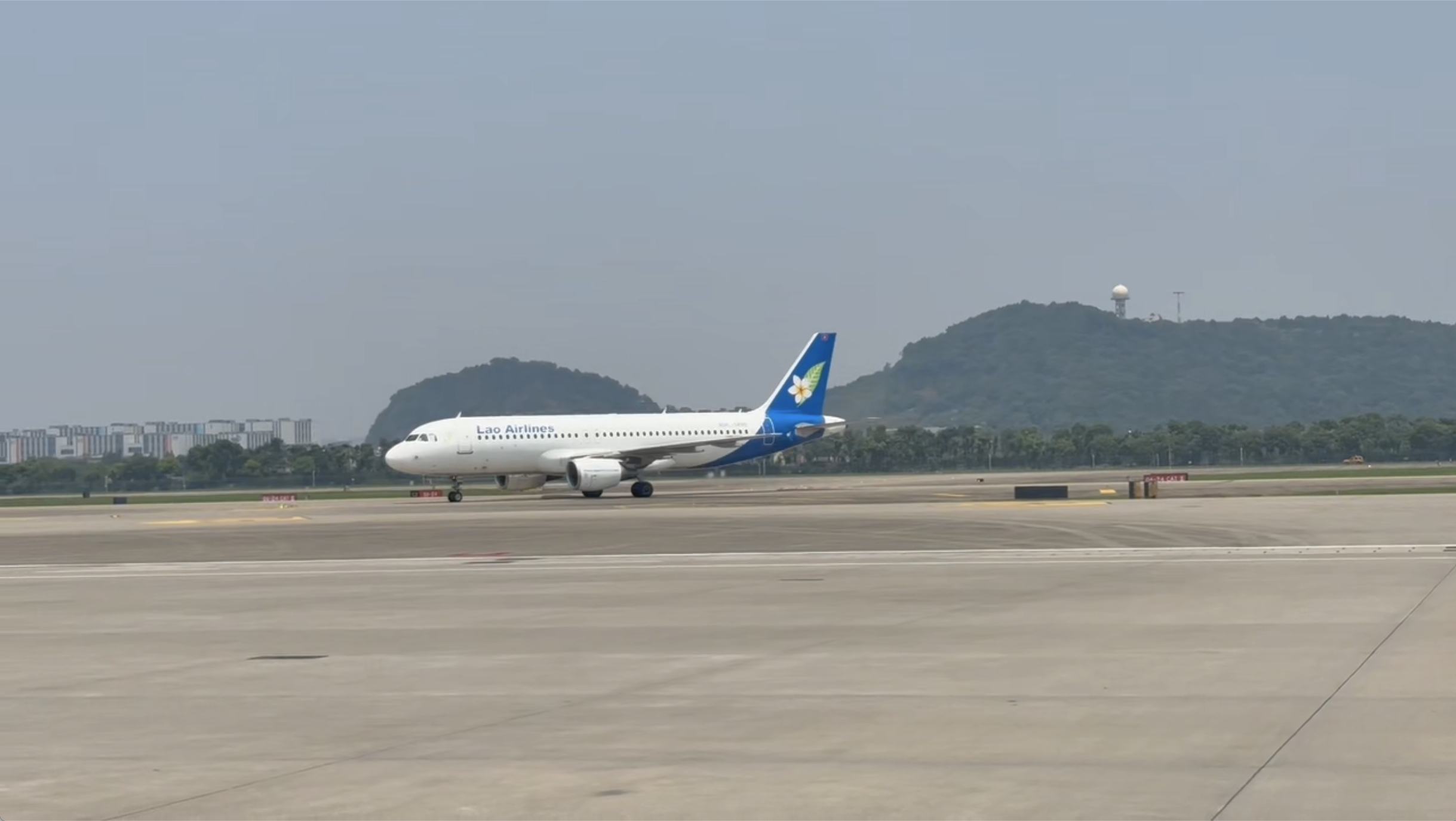 Lao top leader Thongloun arrives in China for state visit