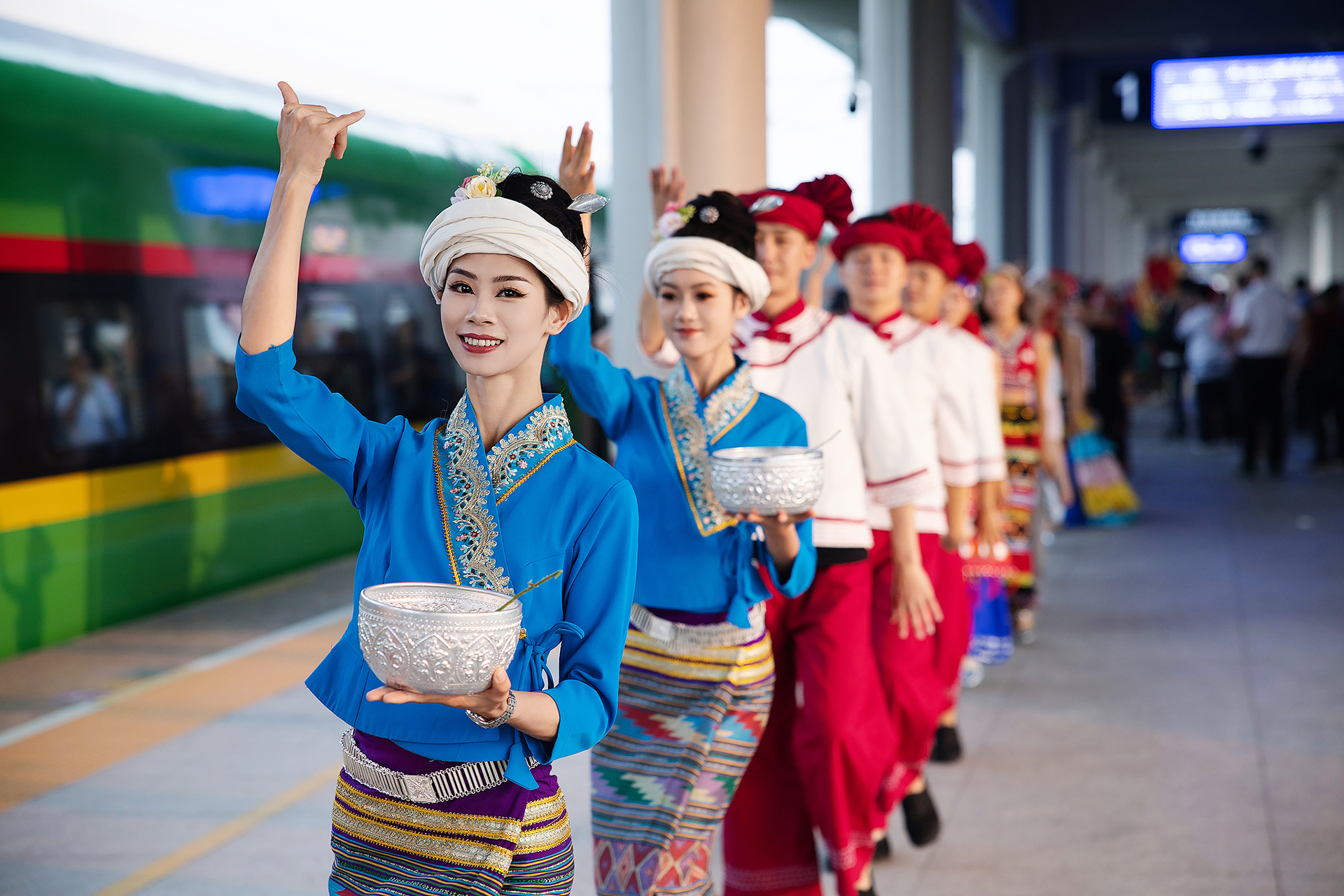 Local people celebrate the launch of the second pair of trains for the China-Laos Railway's international passenger service in Xishuangbanna, southwest China's Yunnan Province on April 13, 2024. The newly launched train service connects Xishuangbanna in China with Luang Prabang in Laos, two popular tourist destinations. /VCG
