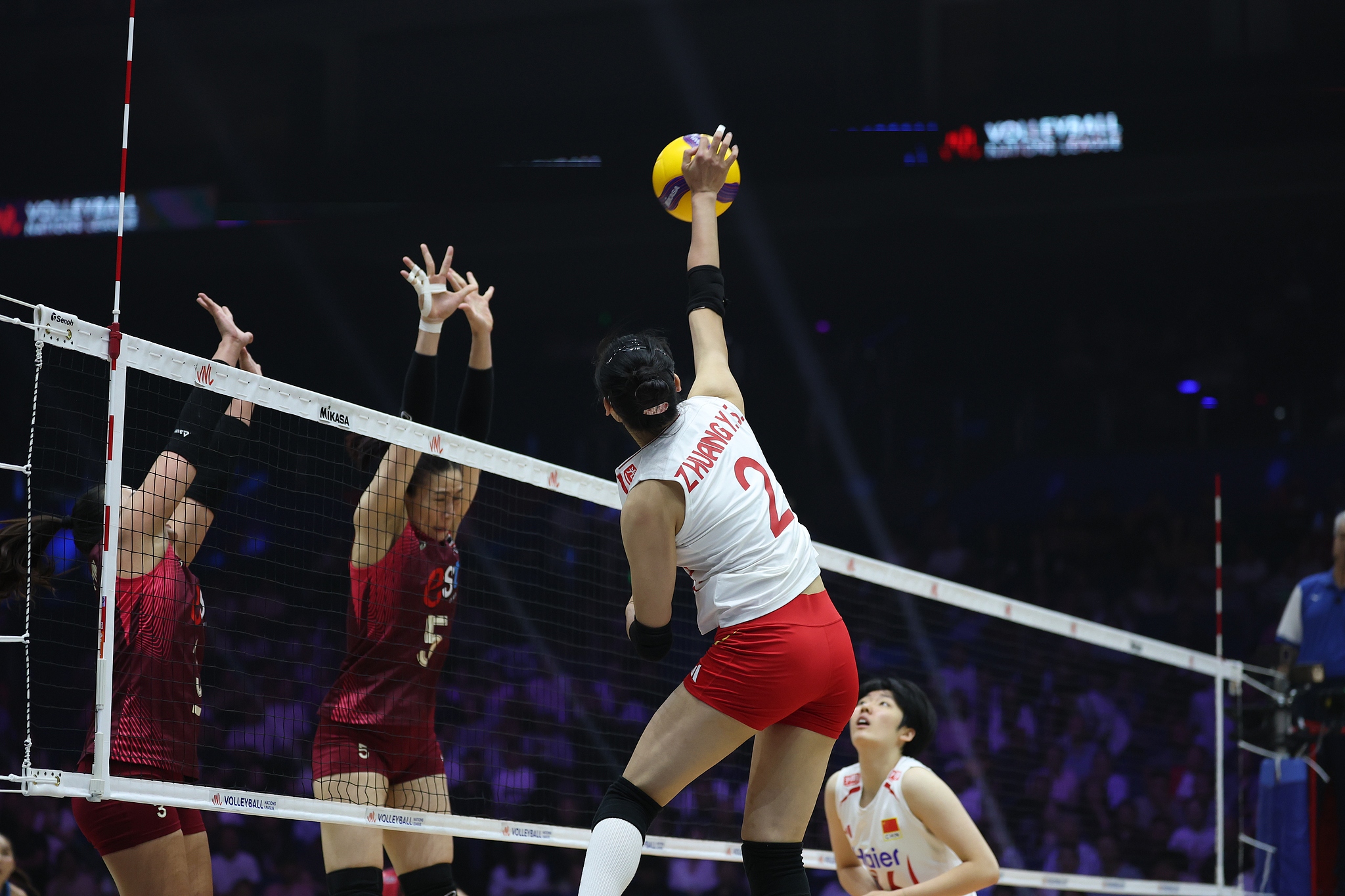 China's Zhuang Yushan (#2) spikes the ball against Thailand in a Pool 3 match in the Women's Volleyball Nations League in Nanjing, east China's Jiangsu Province. /VCG