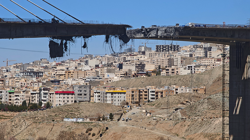 Concrete and rebar dangle from a damaged B1 bridge, a day after it was destroyed by an airstrike, west of Tehran in Karaj, Iran, April 3, 2026. /VCG