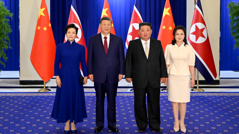 Xi Jinping (2nd L), general secretary of the Communist Party of China Central Committee and Chinese president, and his wife Peng Liyuan (L), pose for a photo with Kim Jong Un (2nd R), general secretary of the Workers' Party of Korea and president of the State Affairs of the Democratic People's Republic of Korea (DPRK), and Kim's wife Ri Sol Ju, in Pyongyang, the DPRK, June 8, 2026. /Xinhua