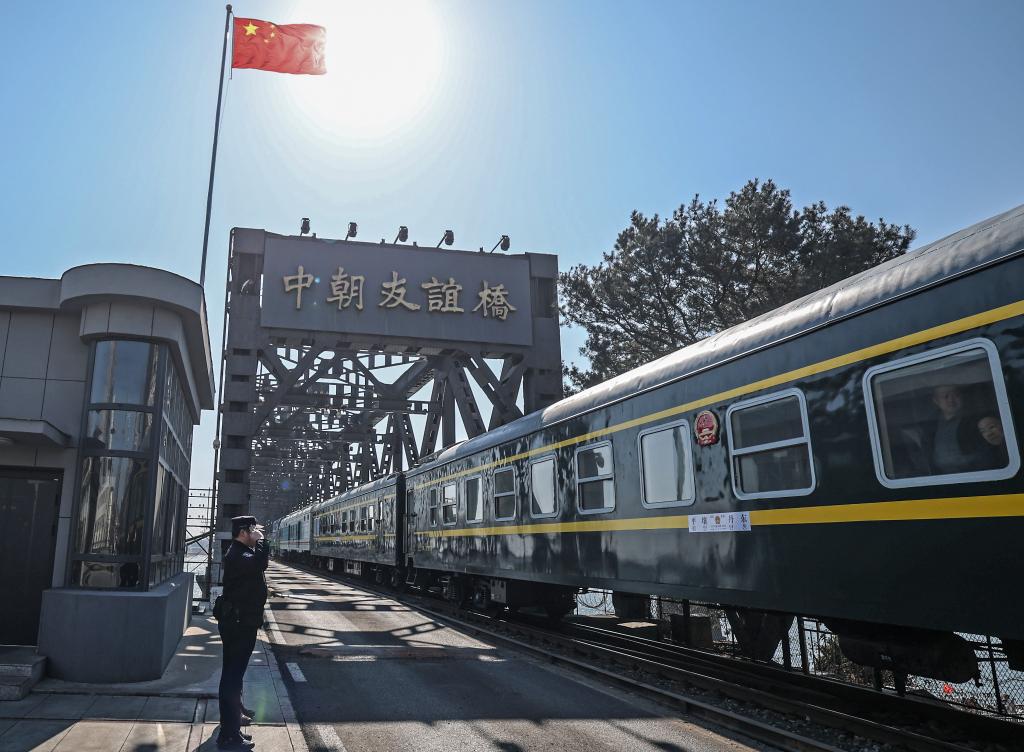 The train No. 95 from Dandong of China to Pyongyang of the Democratic People's Republic of Korea (DPRK) passes a border bridge in Dandong, northeast China's Liaoning Province, March 12, 2026. /Xinhua