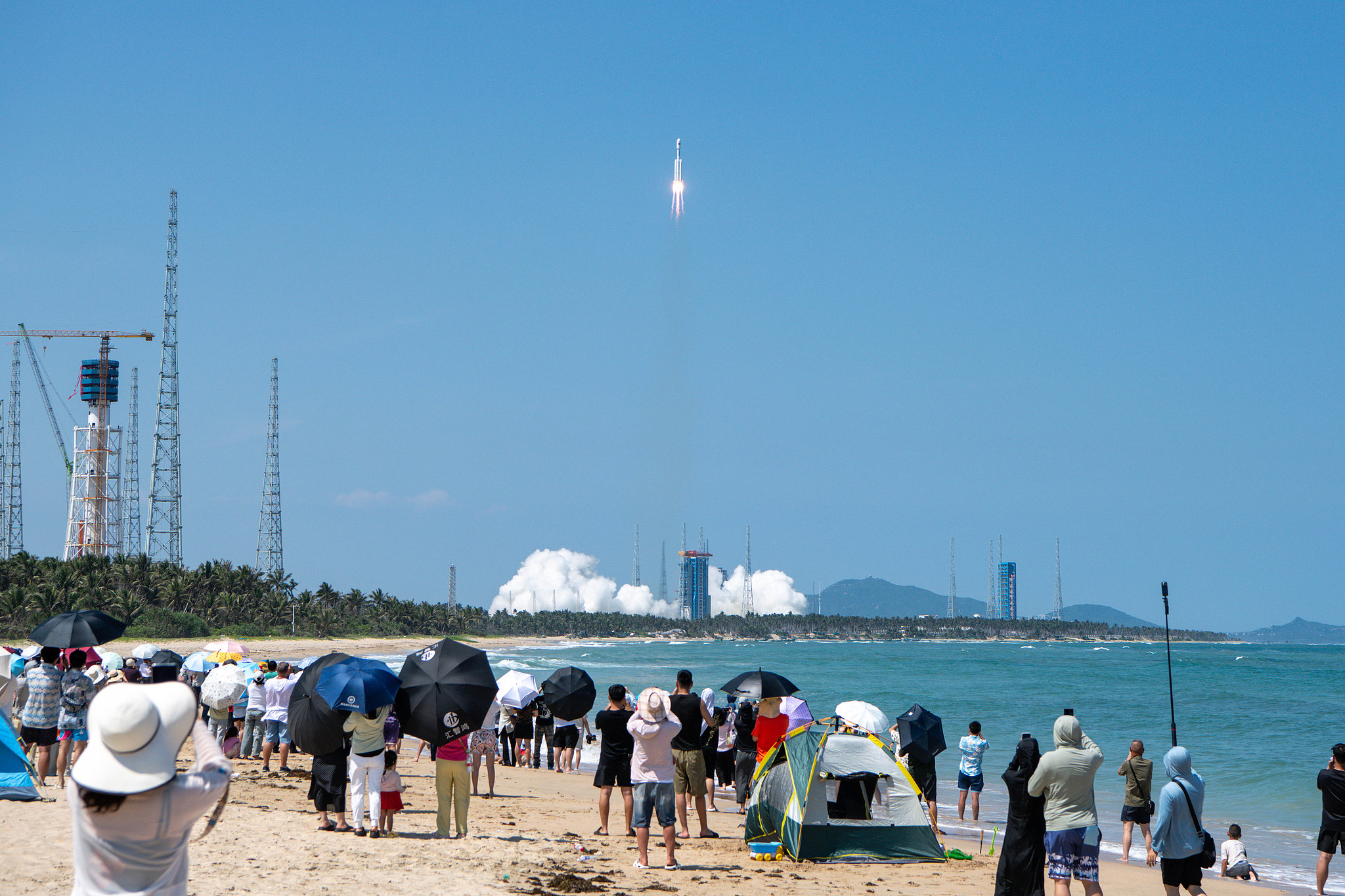 People watch the launch of a Long March-8 rocket carrying Qianfan satellites, Wenchang City, south China's Hainan Province, June 5, 2026. /VCG