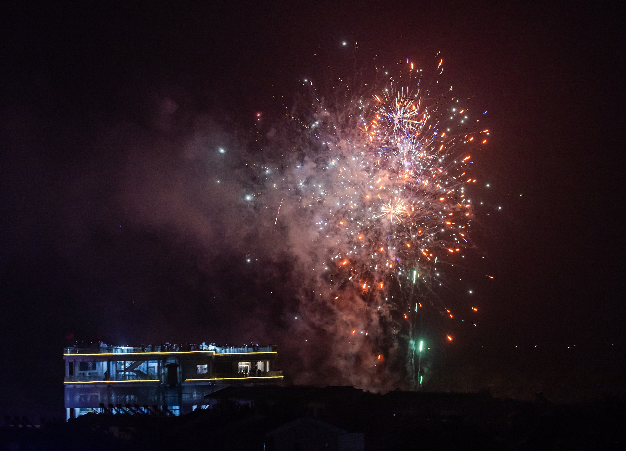Fireworks light up the Yaoguang rocket launch viewing platform celebrating the successful launch of Qianfan constellation satellites, Wenchang City, south China's Hainan Province, April 7, 2026. /VCG