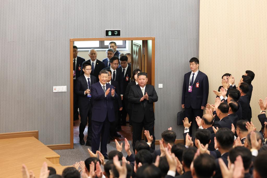 Xi Jinping, general secretary of the Communist Party of China Central Committee and Chinese president, walks into a lecture hall of the Central Cadres Training School of the Workers' Party of Korea (WPK) in the company of Kim Jong Un, general secretary of the WPK and president of the State Affairs of the Democratic People's Republic of Korea (DPRK), in Pyongyang, the DPRK, June 9, 2026. /Xinhua