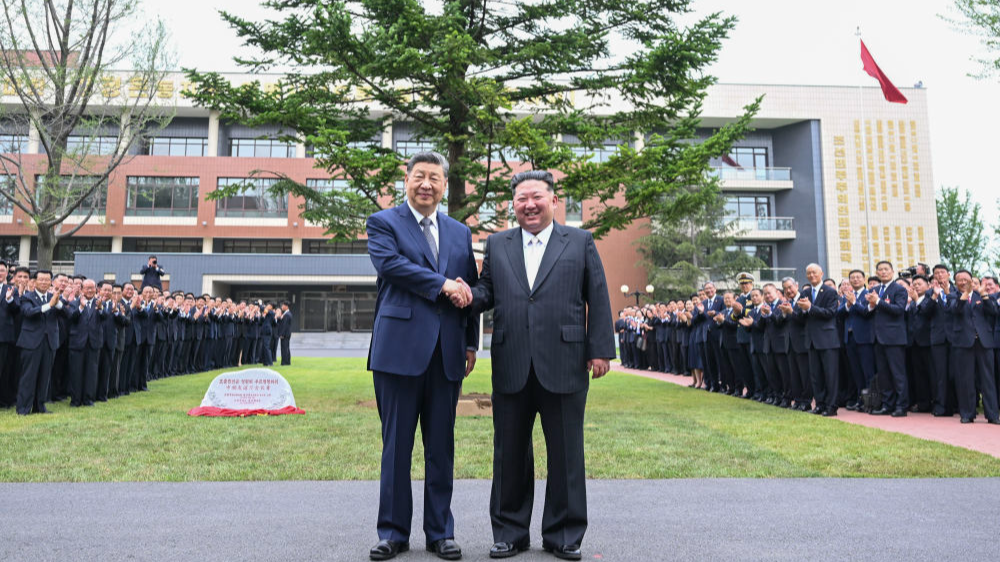 Xi Jinping, general secretary of the Communist Party of China Central Committee and Chinese president, and Kim Jong Un, general secretary of the Workers' Party of Korea (WPK) and president of the State Affairs of the Democratic People's Republic of Korea (DPRK), pose for a photo during a visit to the Central Cadres Training School of the WPK in Pyongyang, the DPRK, June 9, 2026. /Xinhua