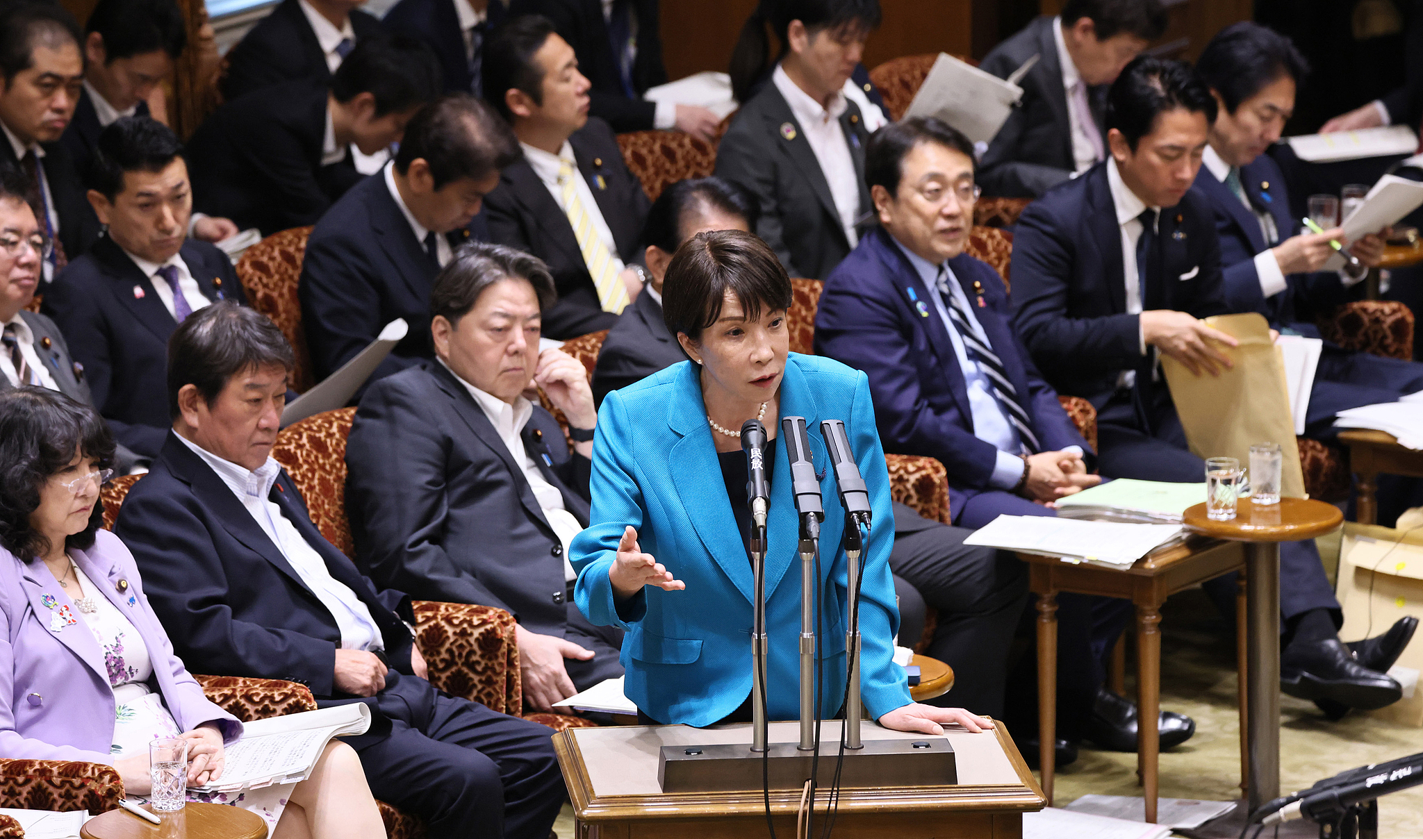 Japanese Prime Minister Sanae Takaichi stands at the lectern and answers questions during the House of Councilors Budget Committee in the Diet building, Chiyoda Ward, Tokyo, Japan, June 4, 2026. /VCG