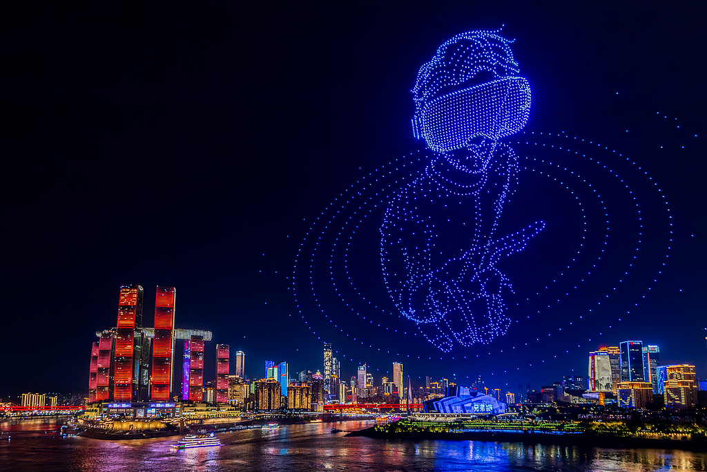 A drone light show illuminates the night sky over Chongqing on June 9, 2026. /VCG