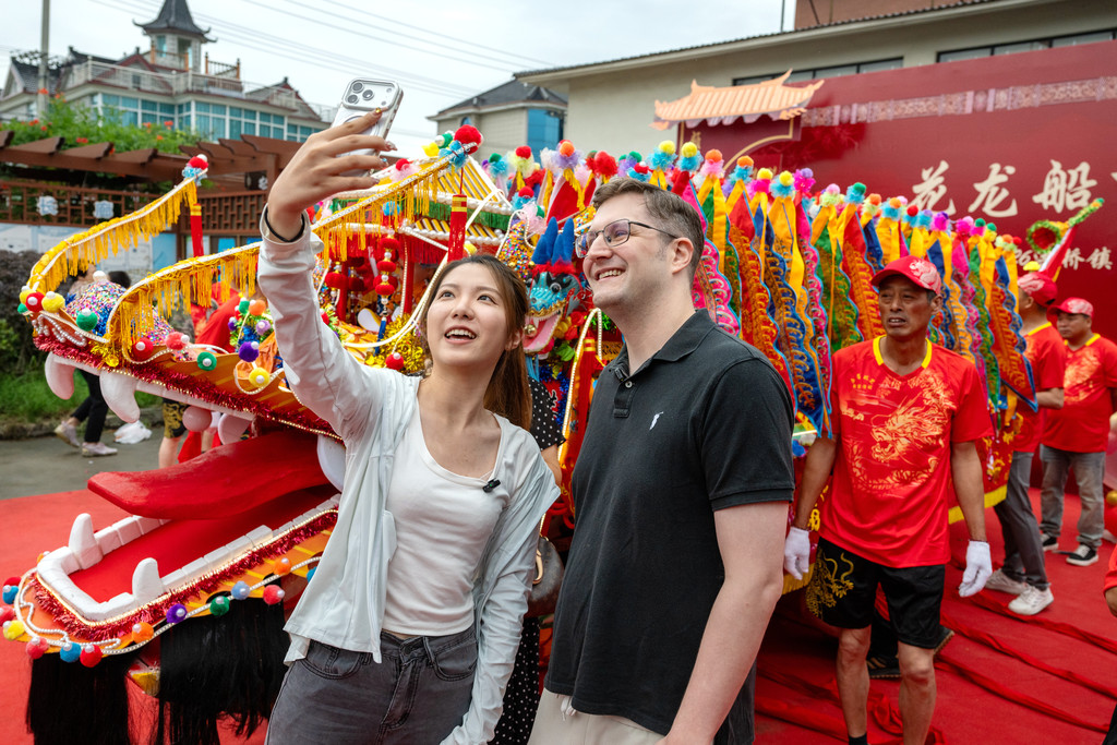 A launch ceremony for floral dragon boats is held in Hongqiao Town, Changxing County, Huzhou City, Zhejiang Province on June 9, 2026. /VCG