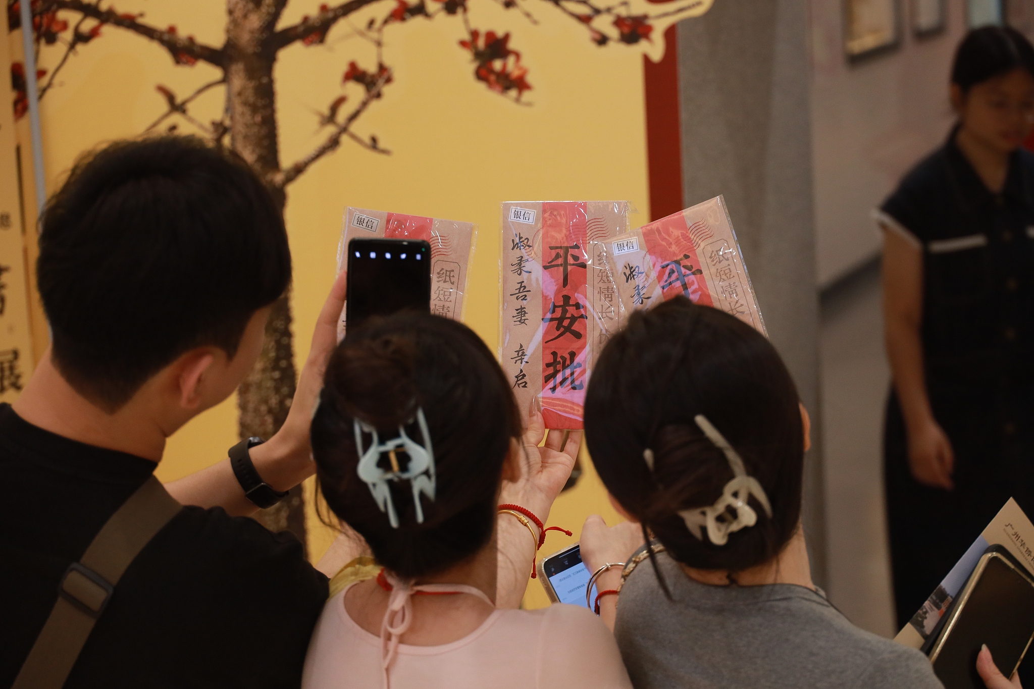 Tourists take photos during the 