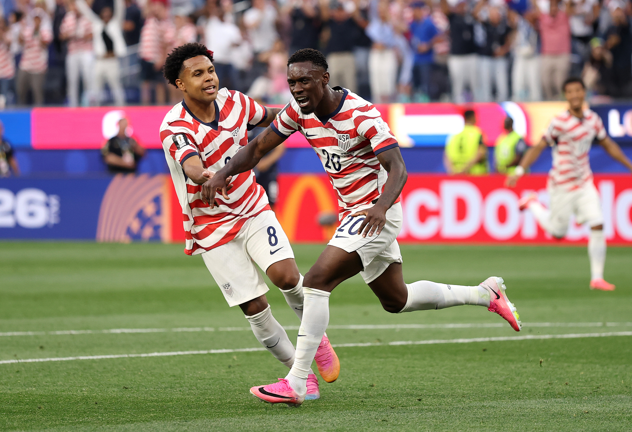 Folarin Balogun (#20) of the United States celebrates scoring his team's second goal during the World Cup Group D match between USA and Paraguay at Los Angeles Stadium in California, June 12, 2026. /VCG