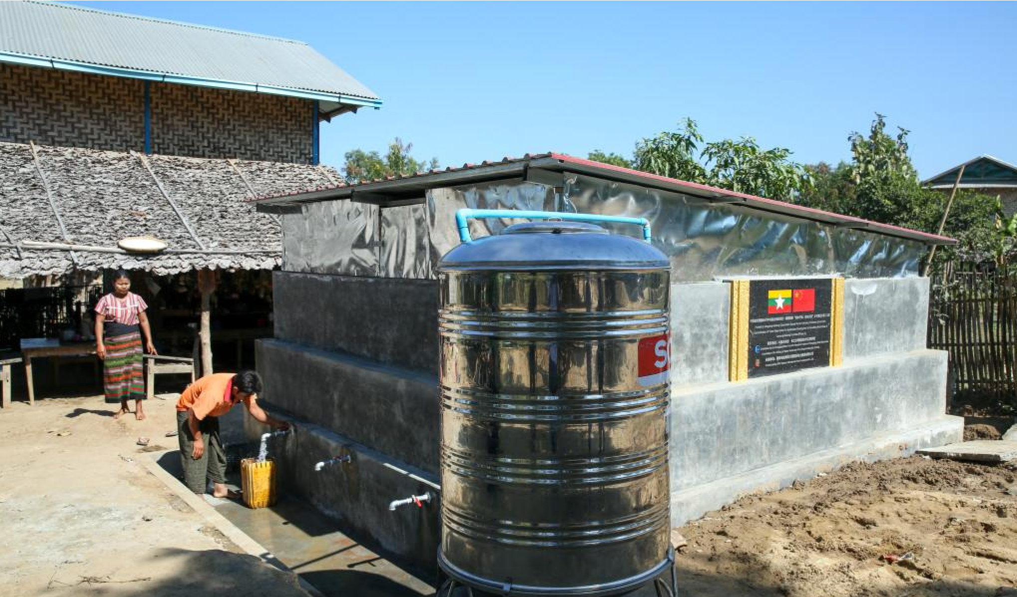 A villager collects water from a water storage tank aided by Lancang-Mekong Cooperation (LMC) Special Fund at Aung Thar village in Lewe township, Nay Pyi Taw, Myanmar, December 27, 2024. /Xinhua