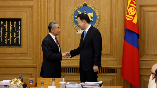 Chinese Foreign Minister Wang Yi (L), also a member of the Political Bureau of the Communist Party of China Central Committee, meets with Mongolian Prime Minister Nyam-Osor Uchral in Ulaanbaatar, Mongolia, June 15, 2026. /Chinese Foreign Ministry