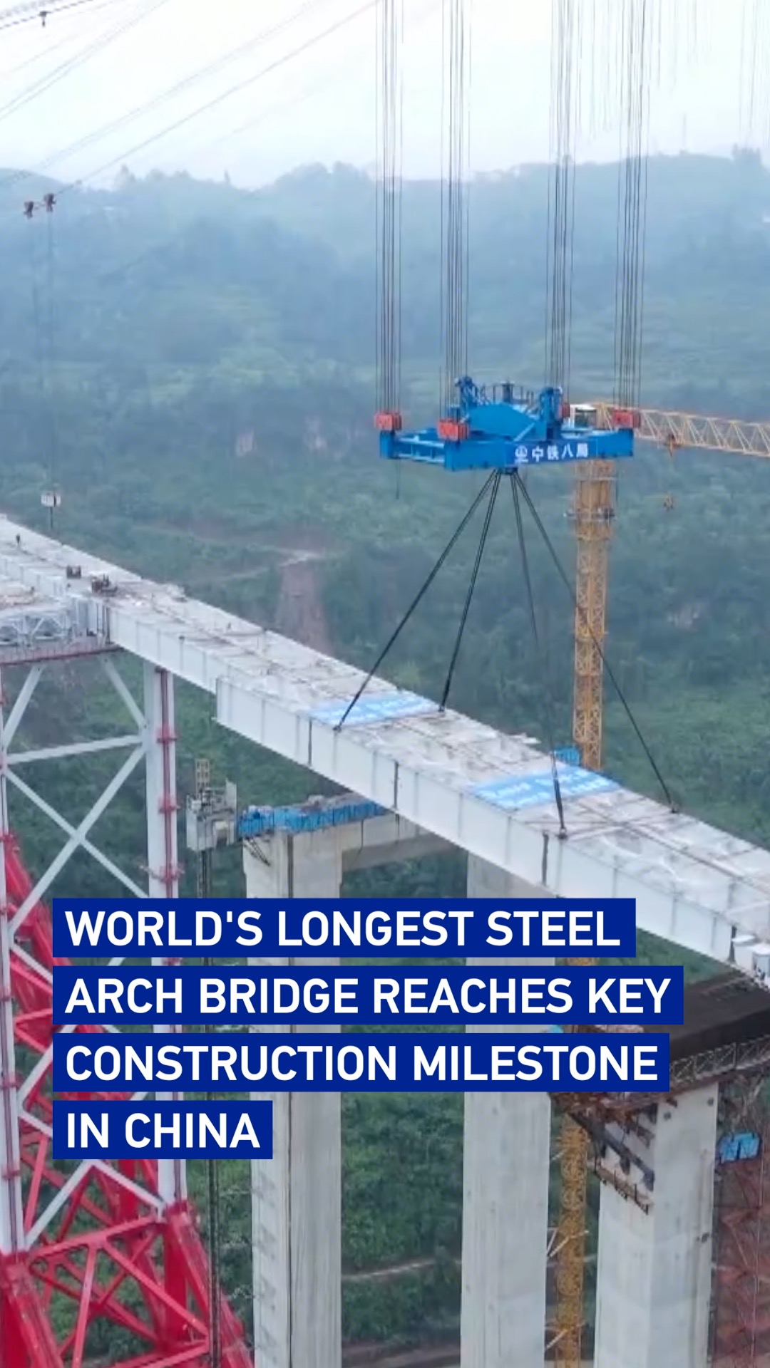World's longest steel arch bridge reaches key construction milestone in China