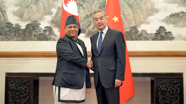 Chinese Foreign Minister Wang Yi shakes hands with Nepali Foreign Minister Shisir Khanal, Beijing, capital of China, June 15, 2026. /Chinese Foreign Ministry