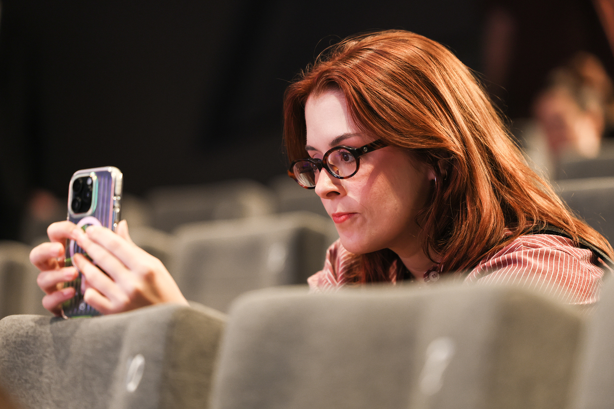 A member of the audience takes a photo at a Q&A session during the 28th Shanghai International Film Festival, Shanghai, June 15, 2026. /CFP