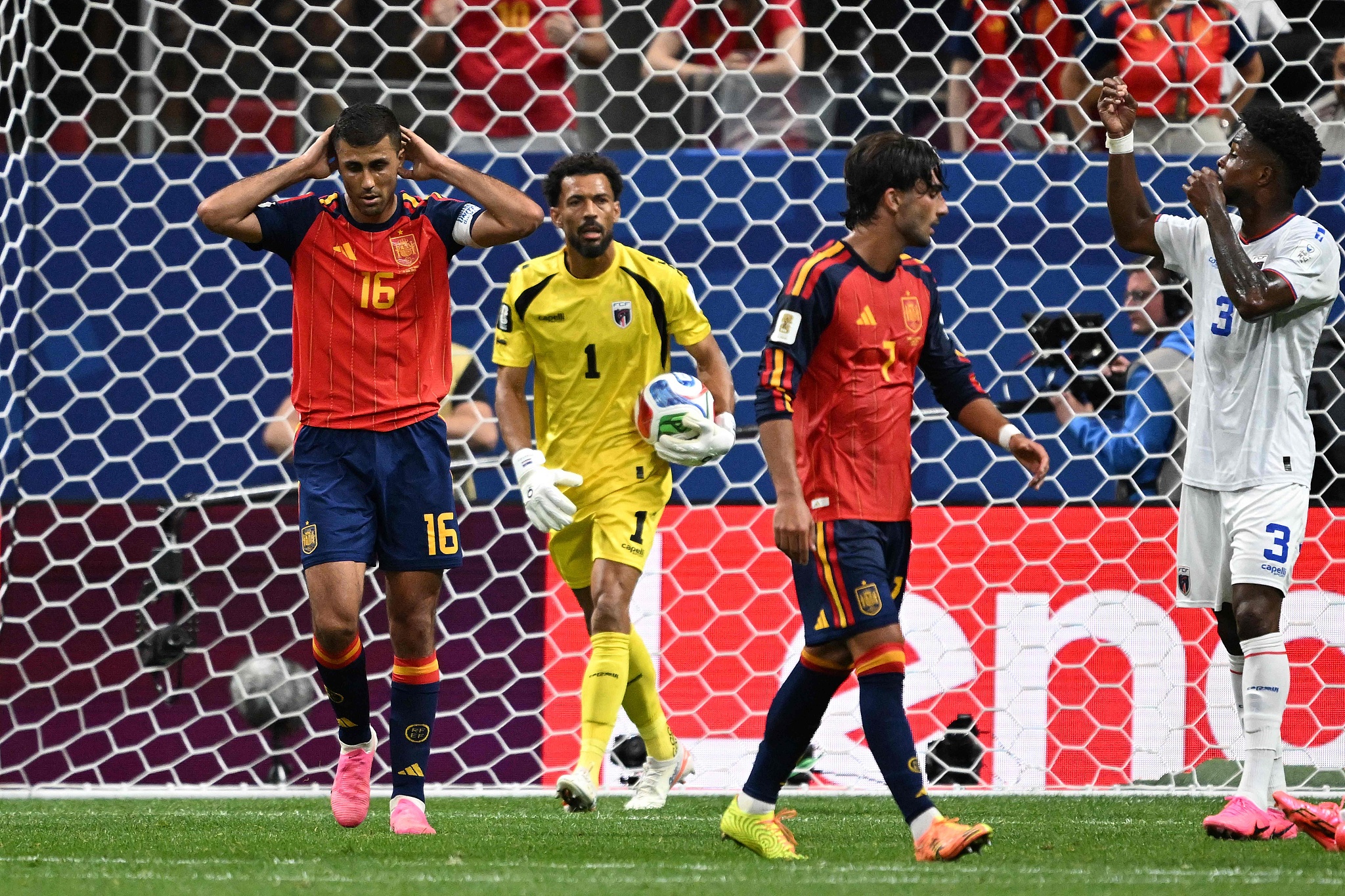 Spain's midfielder #16 Rodri (L) reacts after next to Cabo Verde's goalkeeper #01 Vozinha (C) after missing a goal opportunity during the World Cup Group H match between Spain and Cabo Verde at the Atlanta Stadium in Atlanta, US, June 15, 2026. 