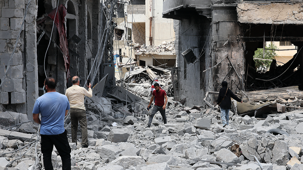 People inspect their homes following Israeli strikes on the historic old market in the town of Nabatieh, southern Lebanon, June 15, 2026. /VCG