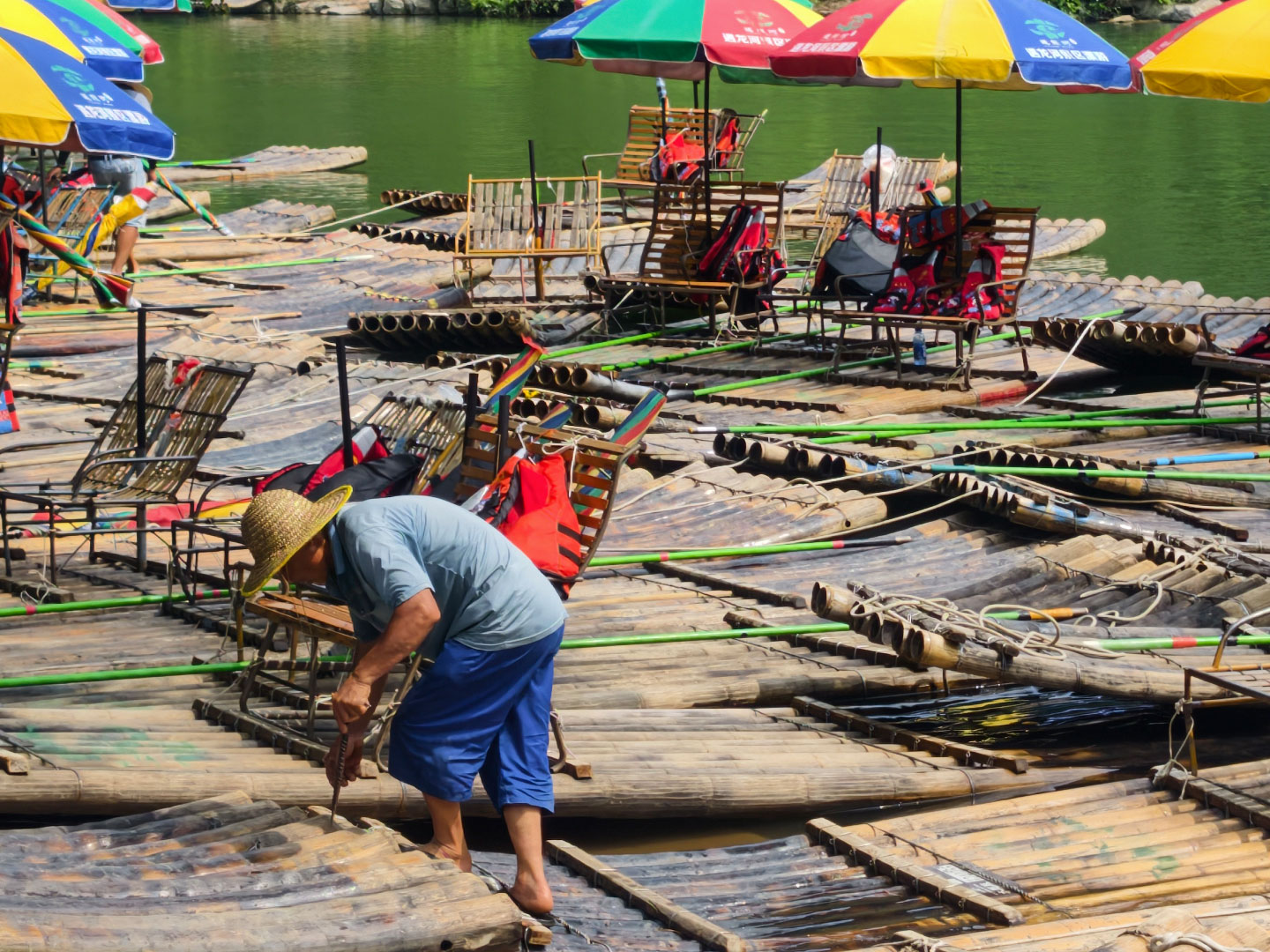 A photo taken on June 2, 2026 shows a view of the dock on the Yulong River in Yangshuo, Guangxi, where bamboo rafts are unloaded and moored. /CGTN