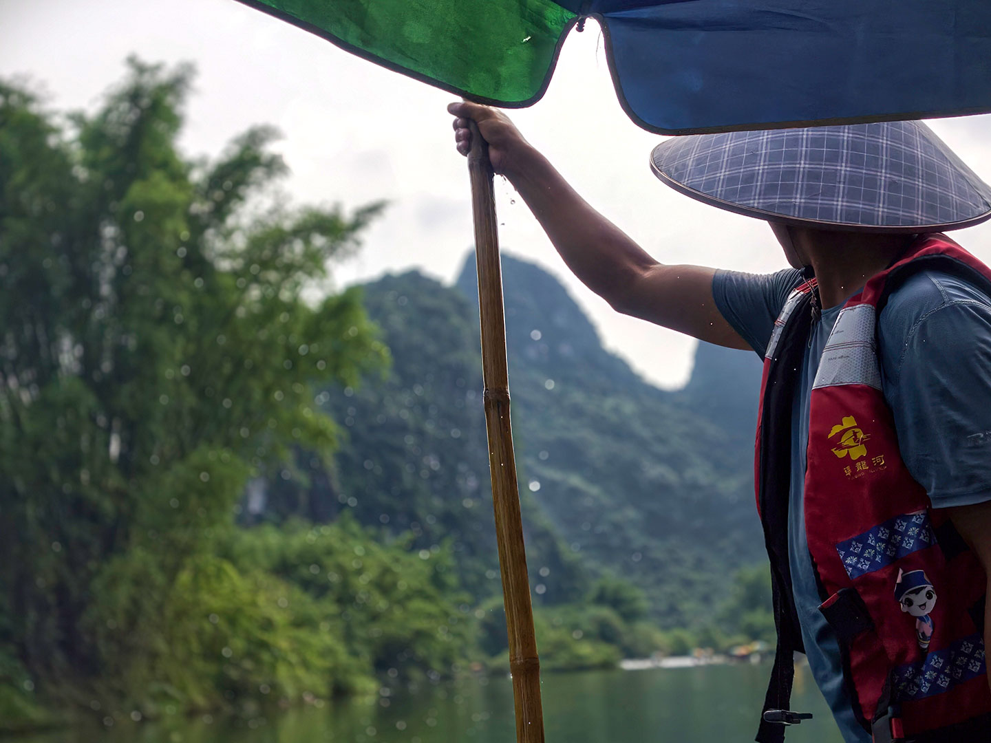 A photo taken on June 2, 2026 shows a view from a bamboo raft floating down the Yulong River in Yangshuo, Guangxi. /CGTN