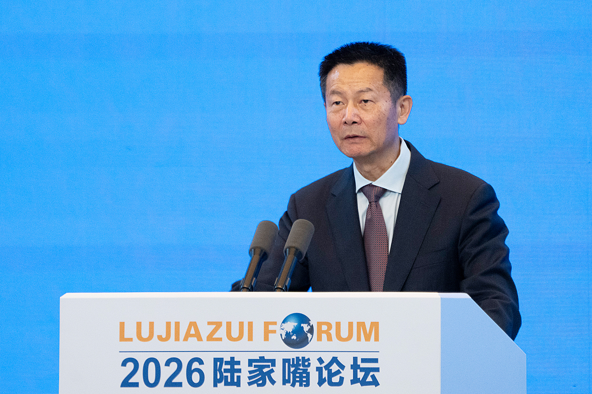 Wu Qing, chairman of China Securities Regulatory Commission, speaks at the Lujiazui Forum in Shanghai, June 17, 2026. /VCG