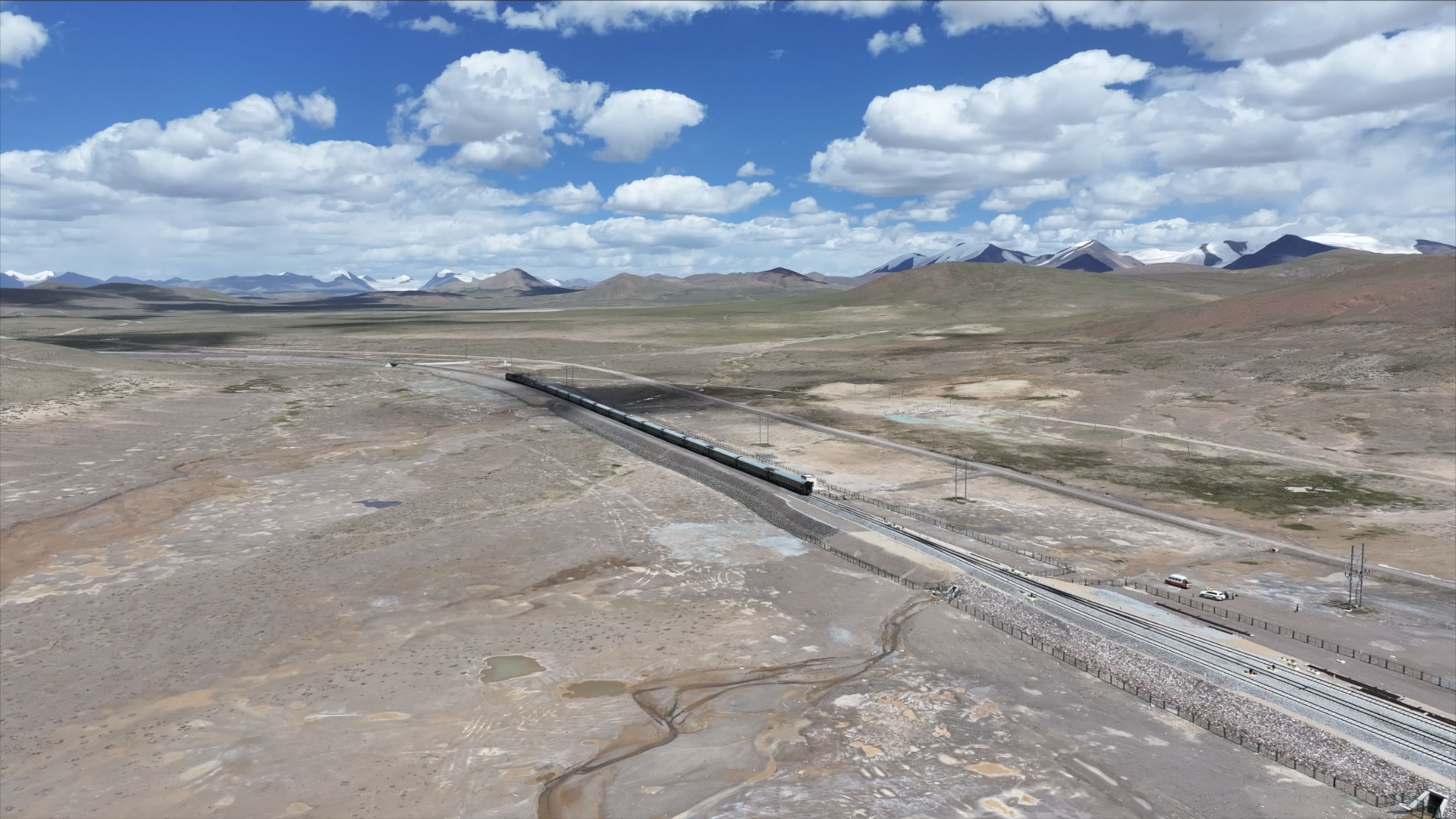A train passes Tanggula Railway Station, the world's highest railway station, at Haixi Mongolian and Tibetan Autonomous Prefecture, Qinghai Province, in July, 2024. /China Railway Qinghai-Xizang Group