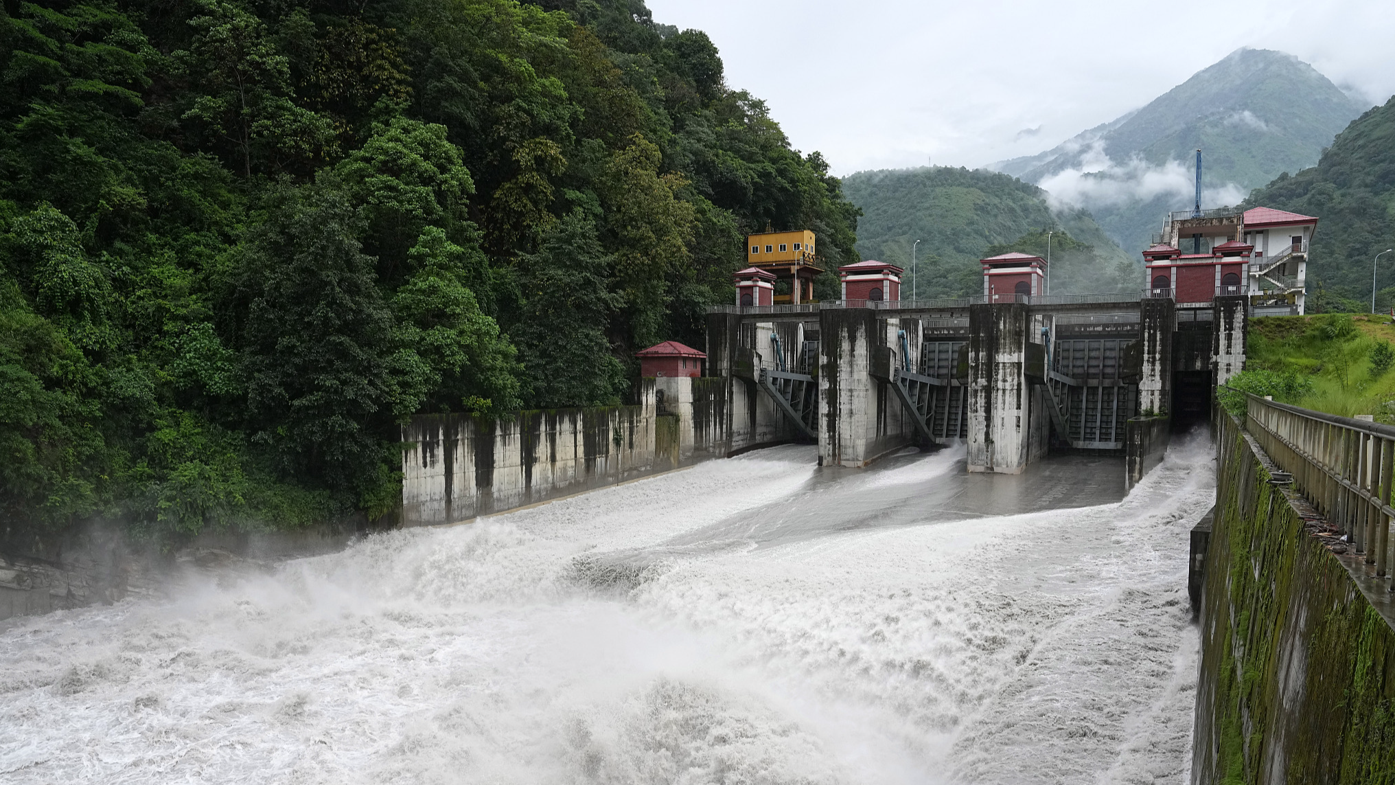 Upper Marsyangdi A Hydropower Station, the first hydropower station in Nepal to be invested, developed, constructed, and operated by a Chinese enterprise, releases water through its gates in Gandaki Province, Nepal, August 8, 2025. Cui Nan/ China News Service (Via VCG)