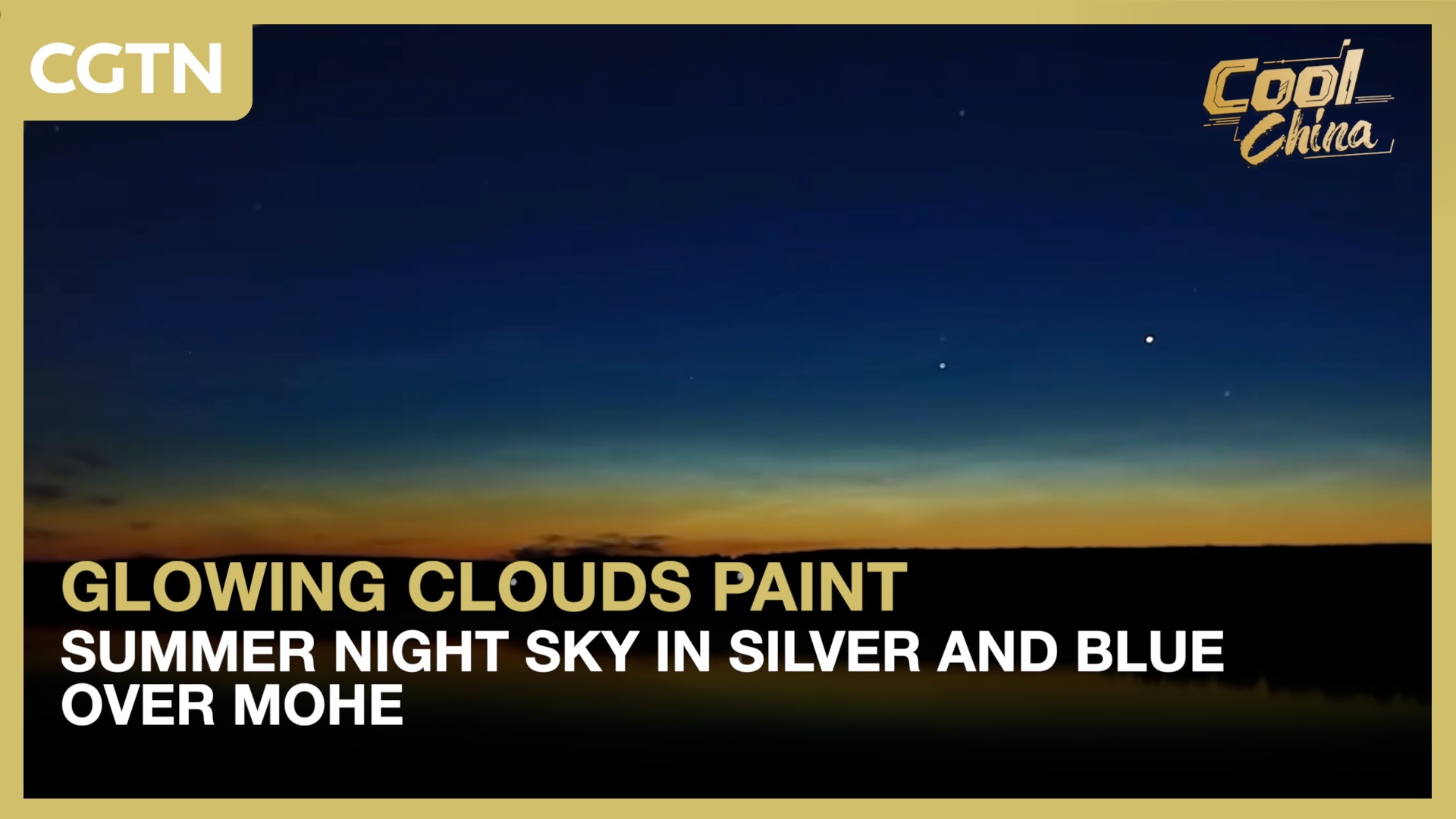 Glowing clouds paint summer night sky in silver and blue over Mohe