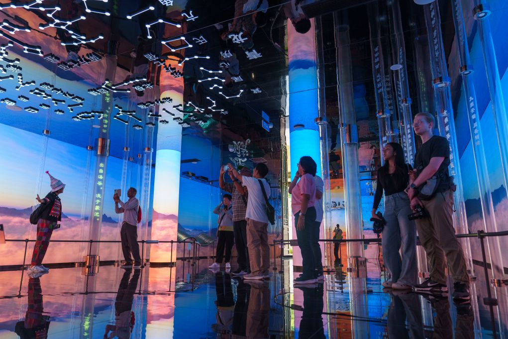 Visitors tour the immersive digital exhibition at the Qu Yuan Temple in Zigui County, a site dedicated to the ancient poet who is commemorated during the Dragon Boat Festival, Hubei Province, central China, June 19, 2026. /Xinhua