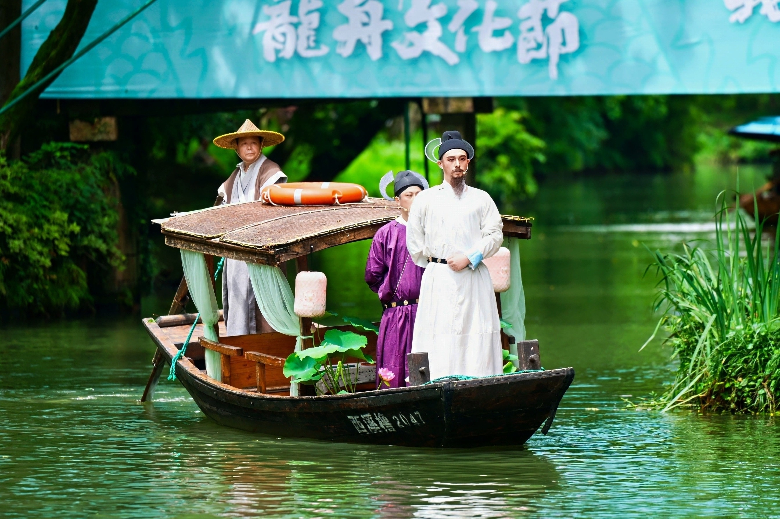 Cultural performances celebrating the Dragon Boat Festival take place right on the water, with artists performing aboard the boats in Hangzhou, east China's Zhejiang Province, June 19, 2026. /Courtesy of CICAF