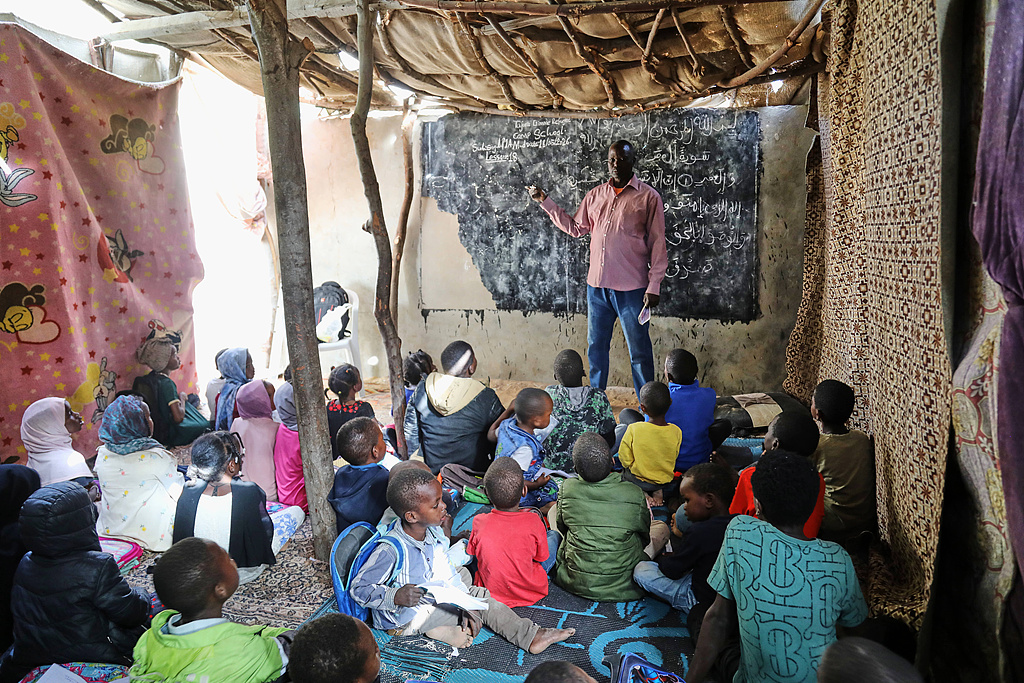 A Sudanese teacher who left Sudan during the civil war teaches at a refugee school for about 73 children in Tajoura, east Tripoli, Libya, May 18, 2026. /VCG