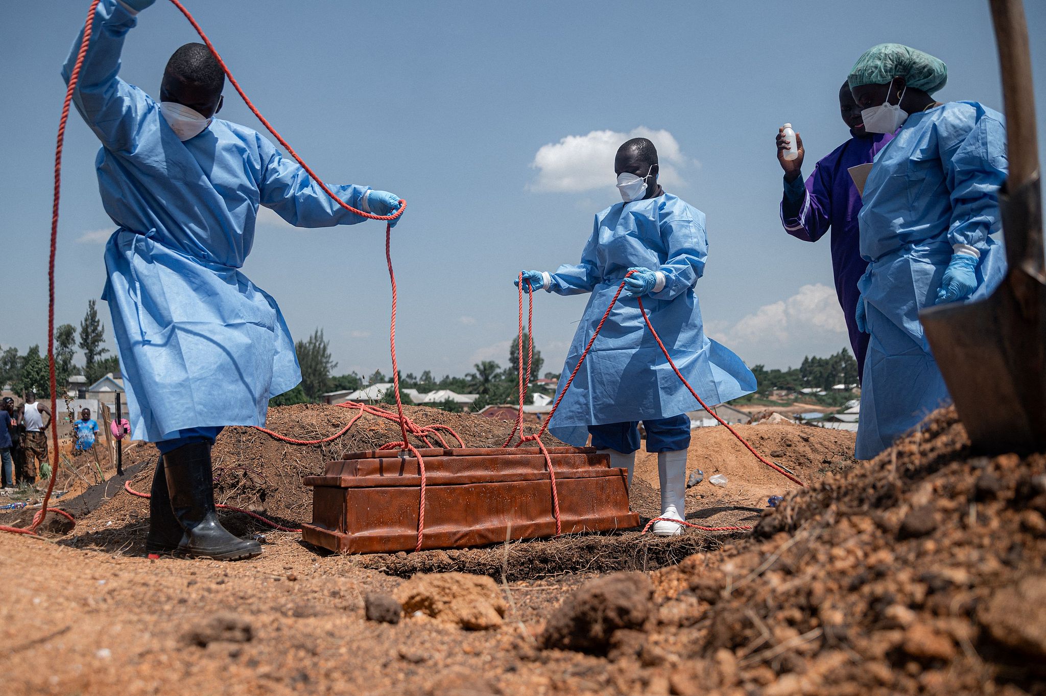 Teams from the International Federation of Red Cross and Red Crescent Societies prepare to bury the body of a fourth orphan who died of Ebola at an orphanage in Bunia, Ituri Province, Democratic Republic of the Congo, June 19, 2026. /CFP