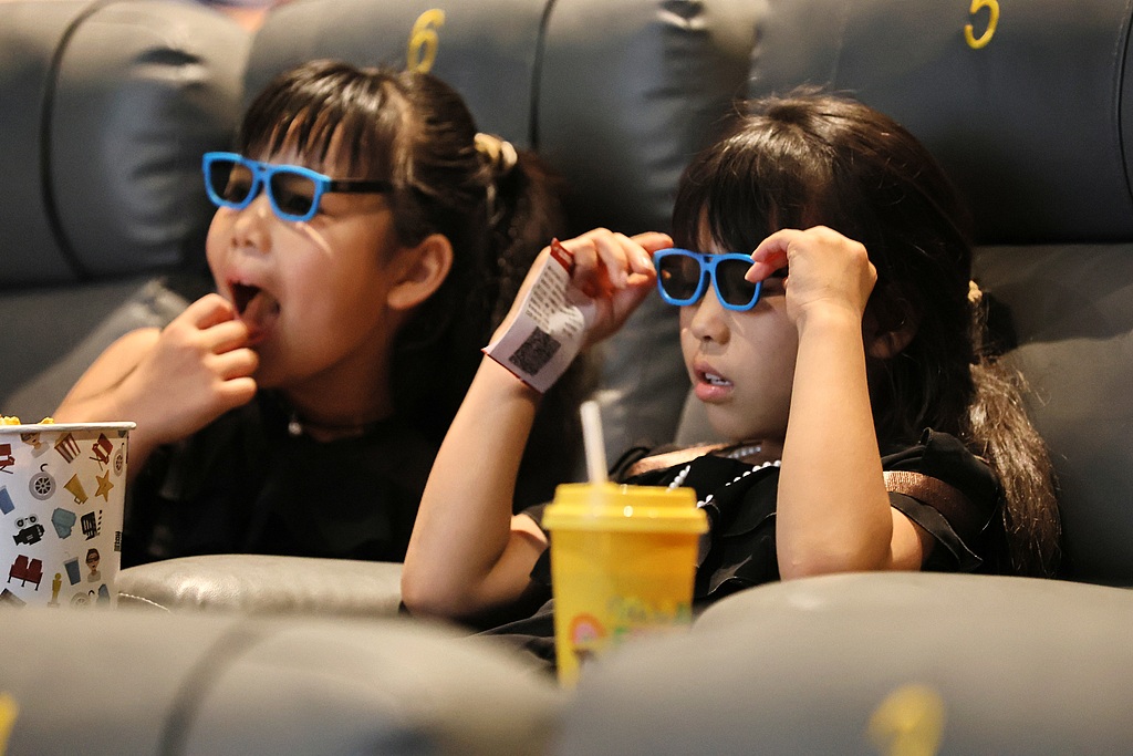 Children watch a movie at a cinema in Jiaxing, Zhejiang Province, China on June 20, 2026. /VCG