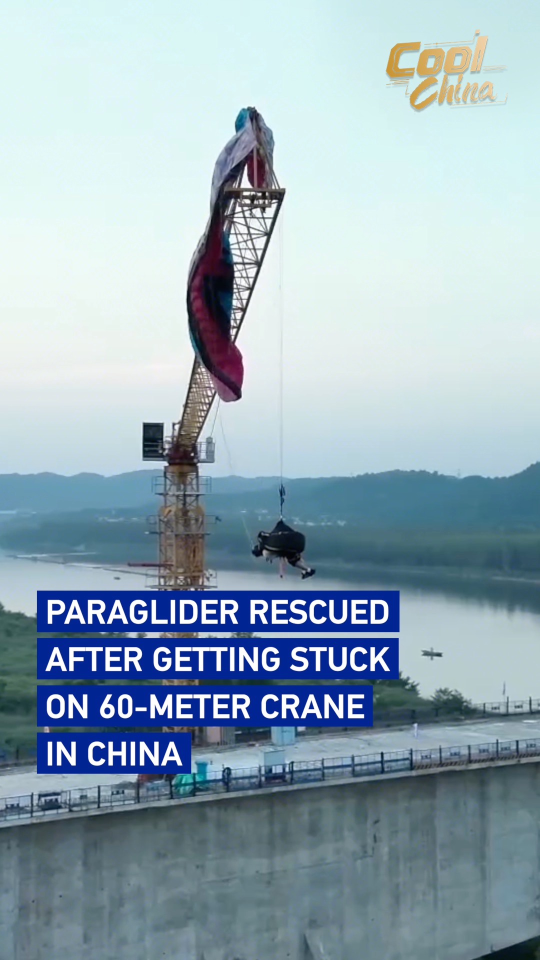 Paraglider rescued after getting stuck on 60-meter crane in China